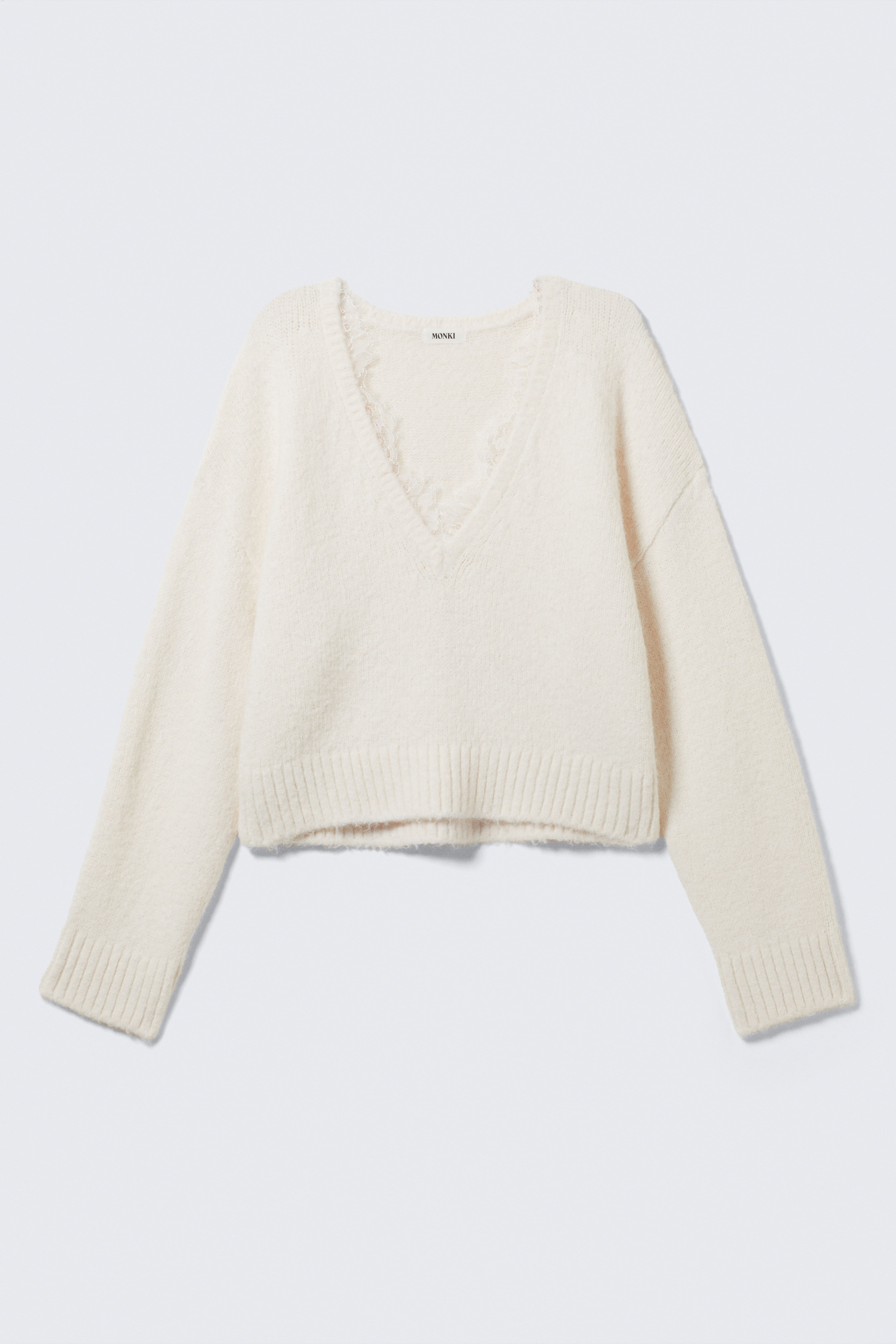 V-ringad tröja med spetskant - Vit