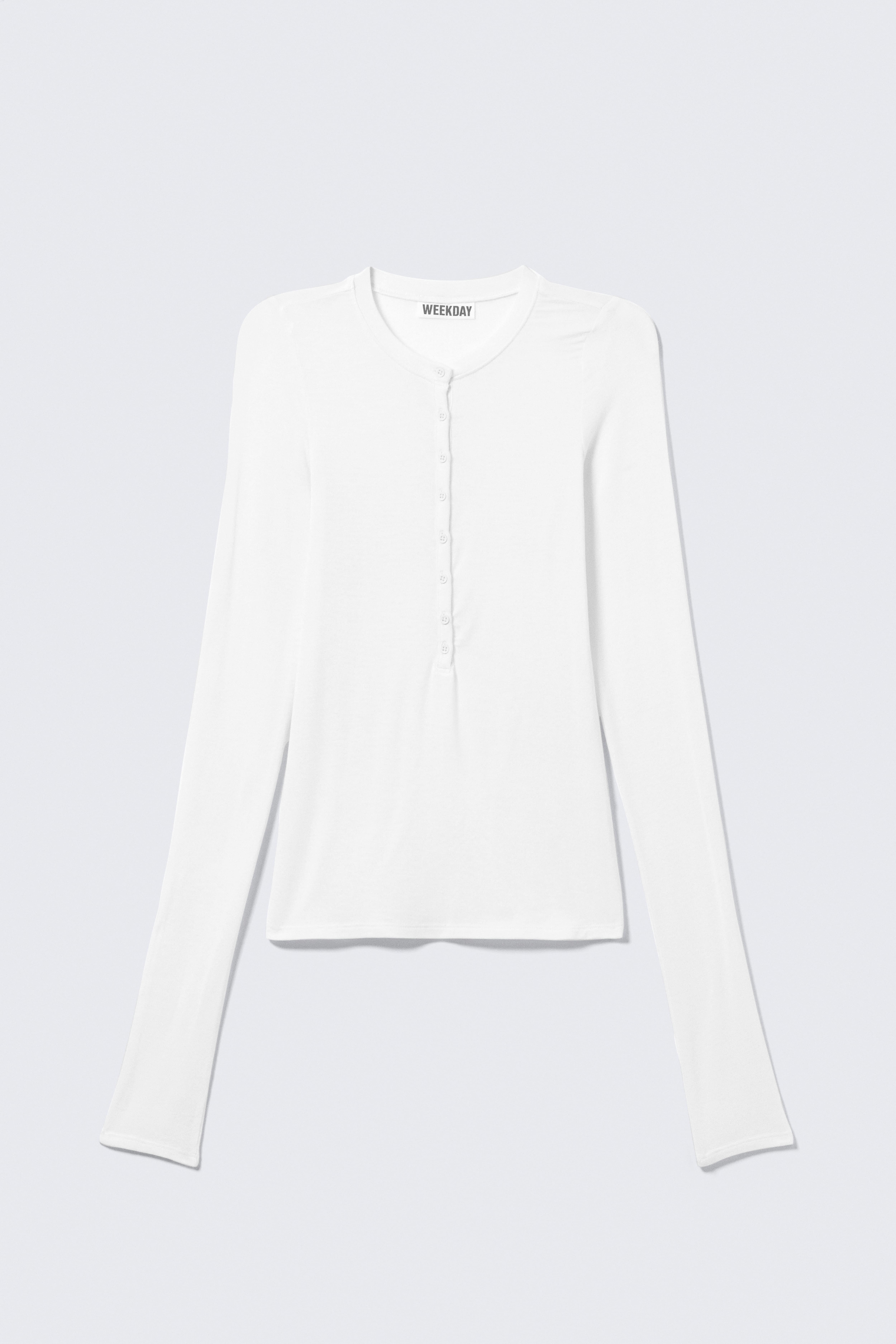 SLANK TOP MET KNOPEN EN LANGE MOUWEN - Wit/Zwart