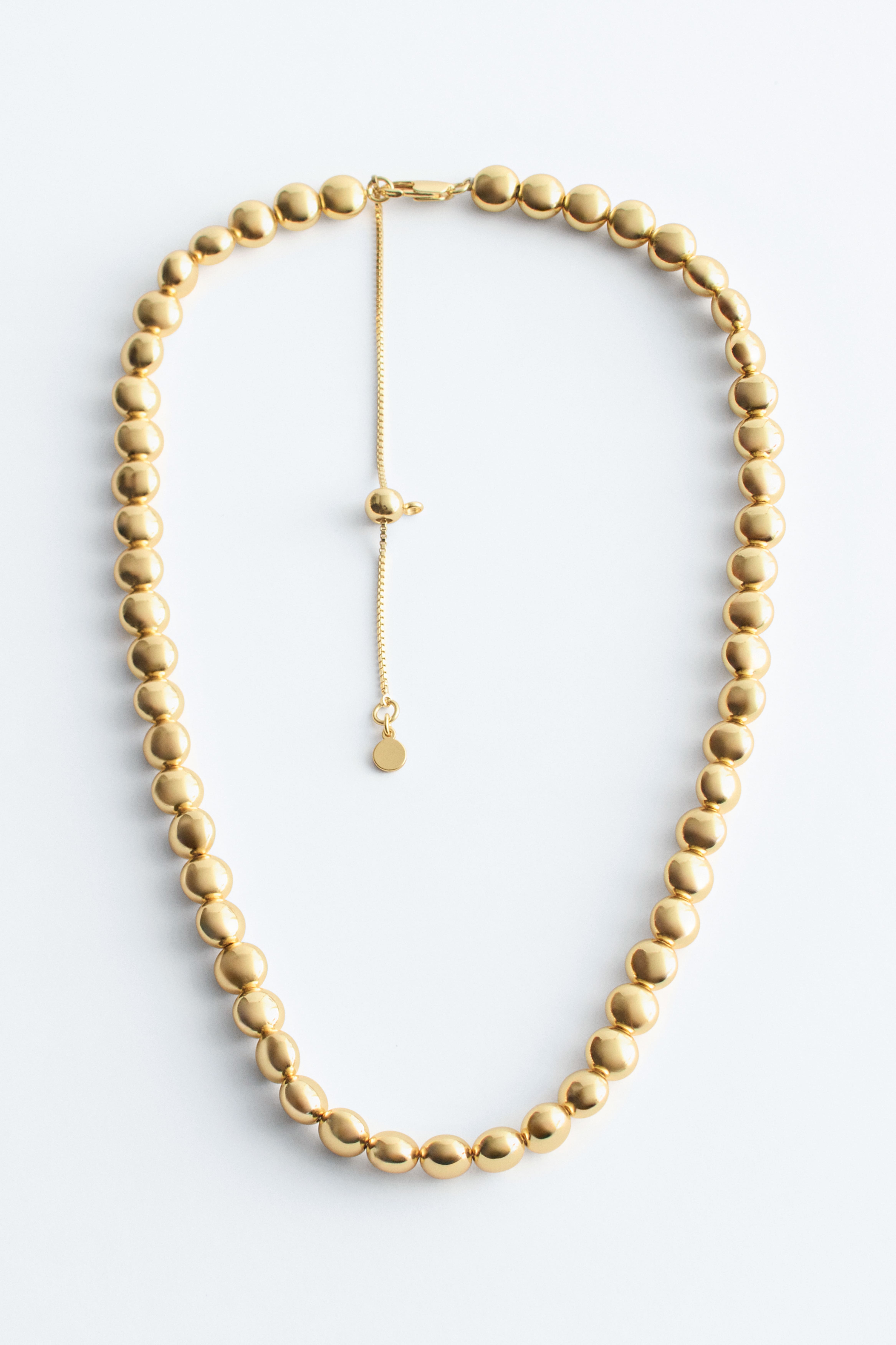 Kurze Perlenkette - Gold