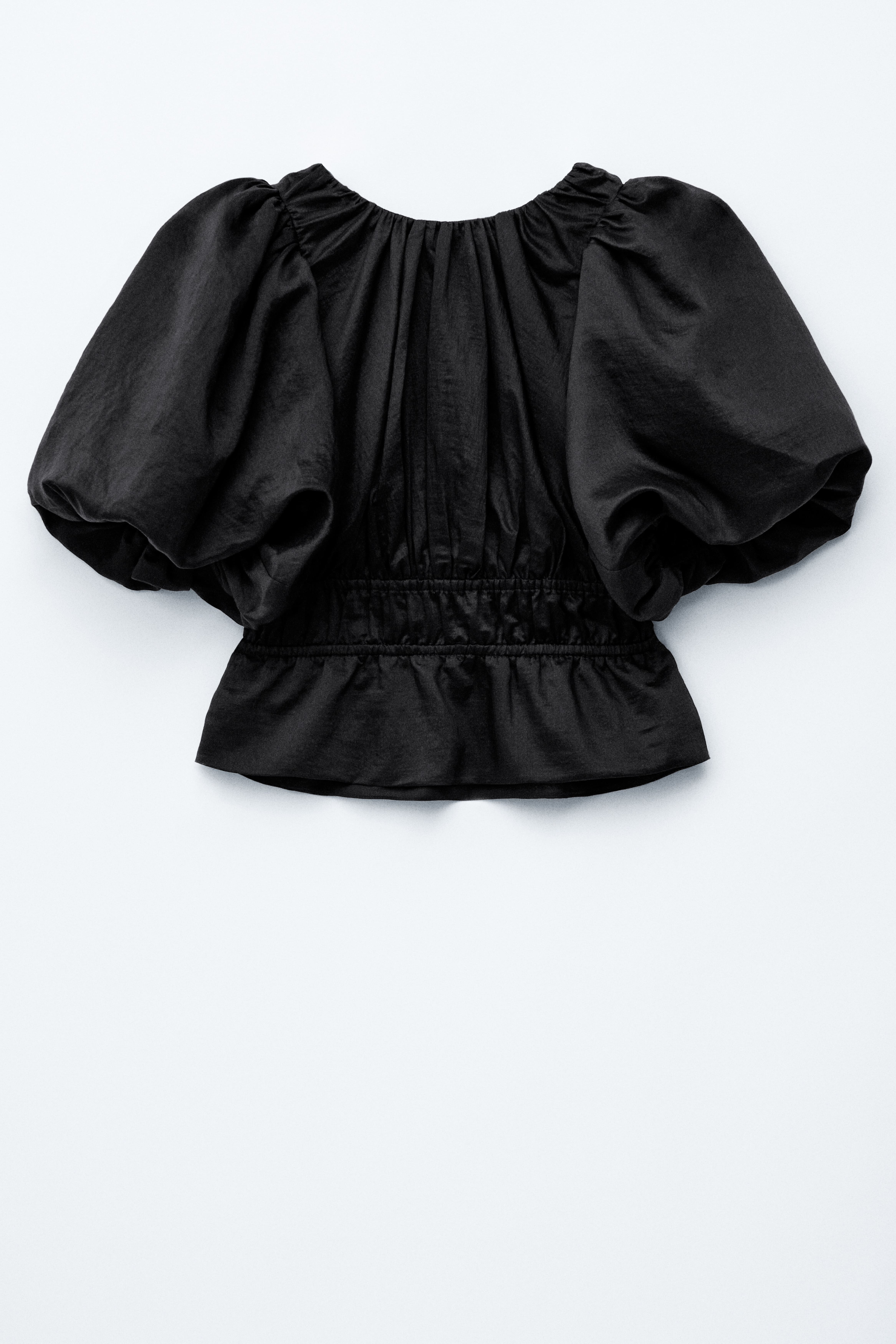 Peplumtopp med puffärm - Svart