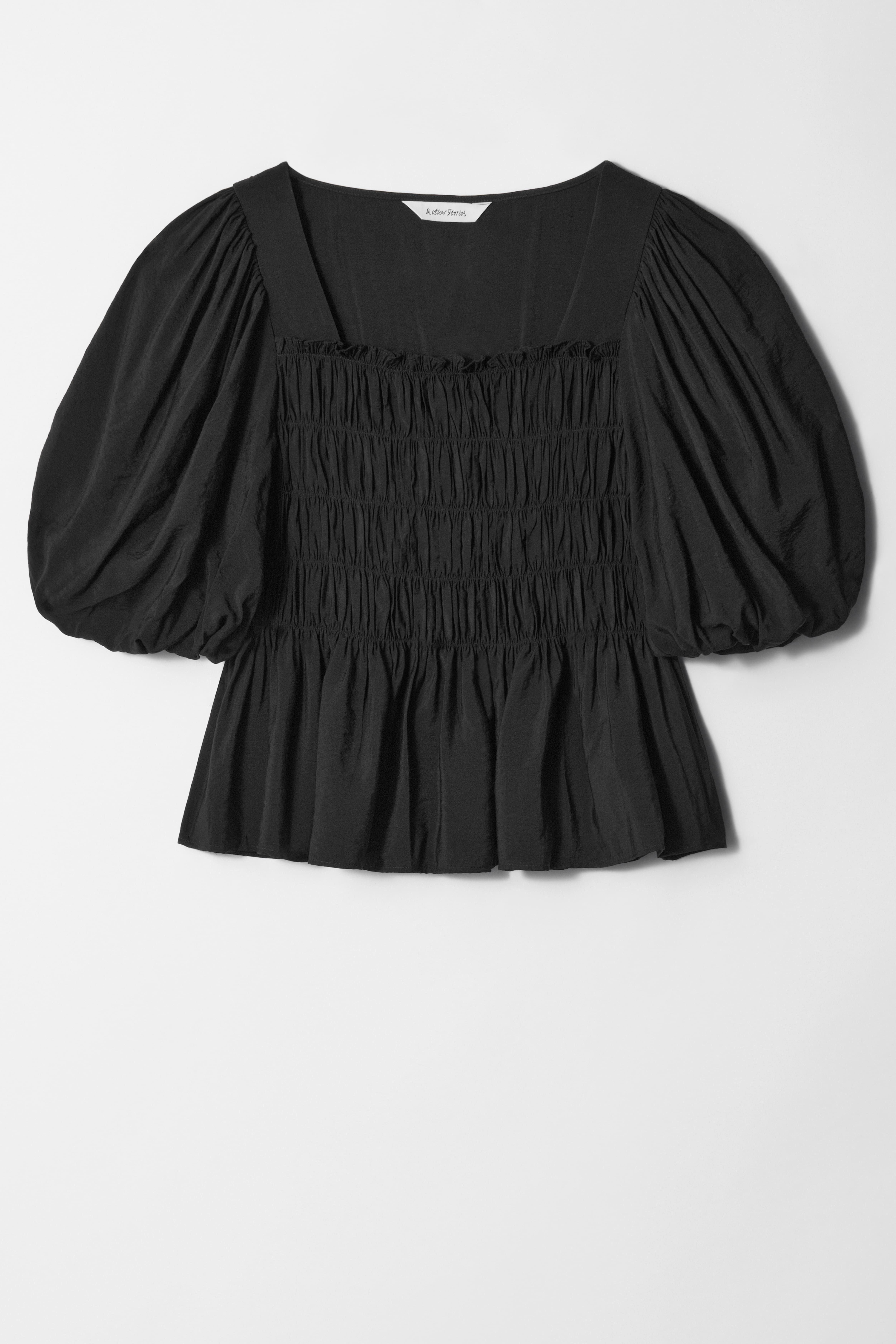 Blusa con maniche a sbuffo e lavorazione smock - Nero