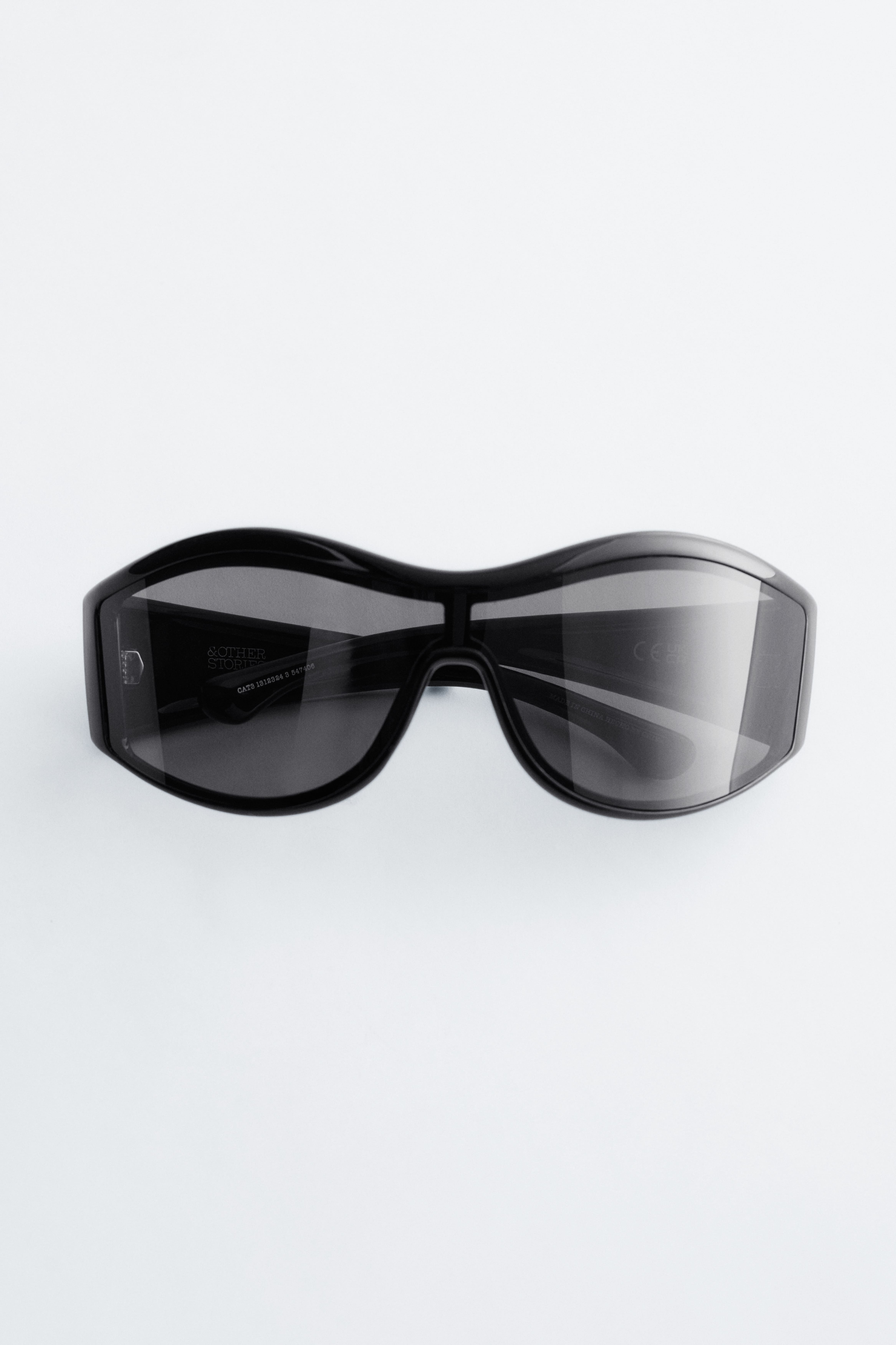 Opvallende zonnebril met ovaal montuur - Zwart/Transparant