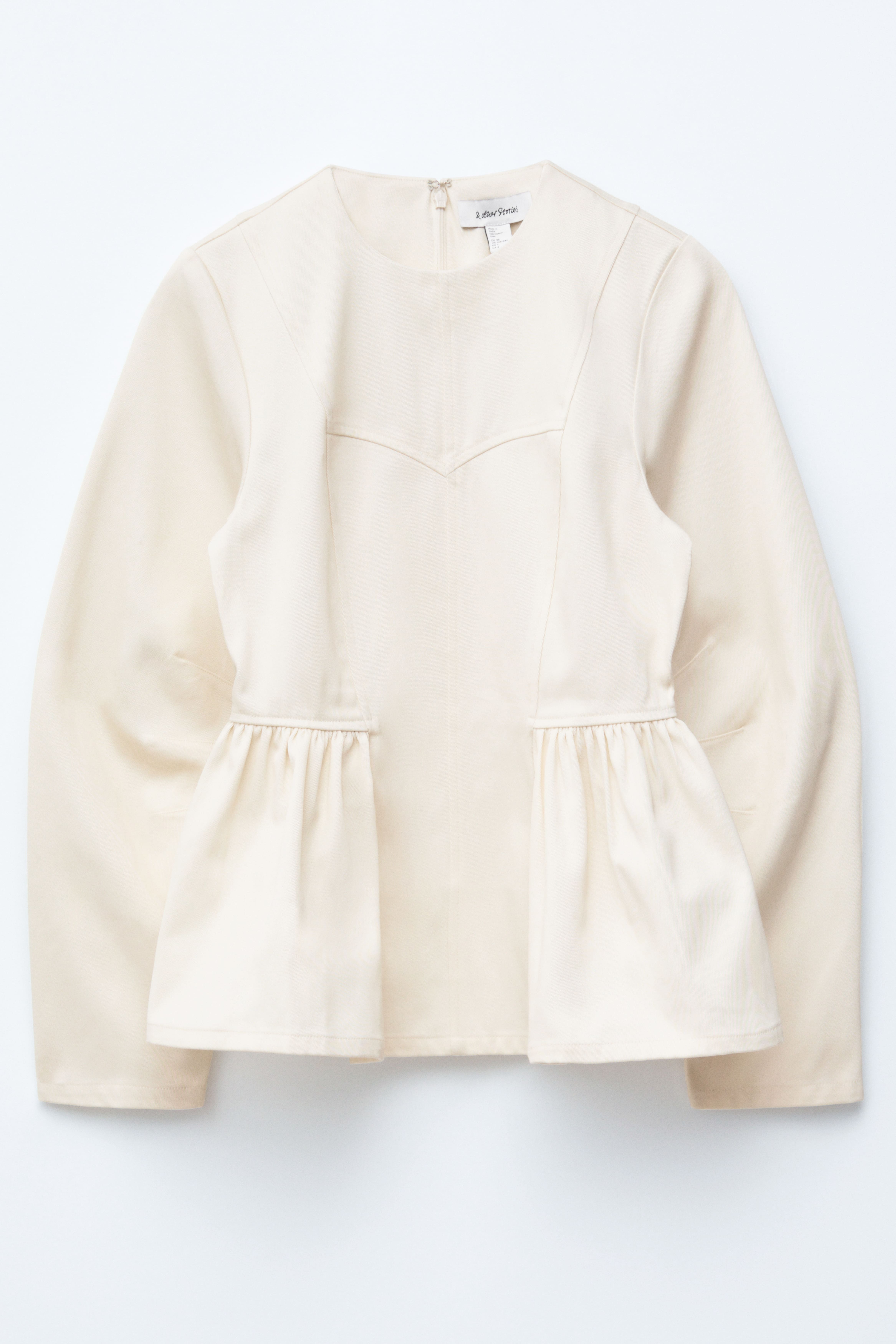 Oberteil aus Baumwolle mit Schößchen - Creme/Schwarz