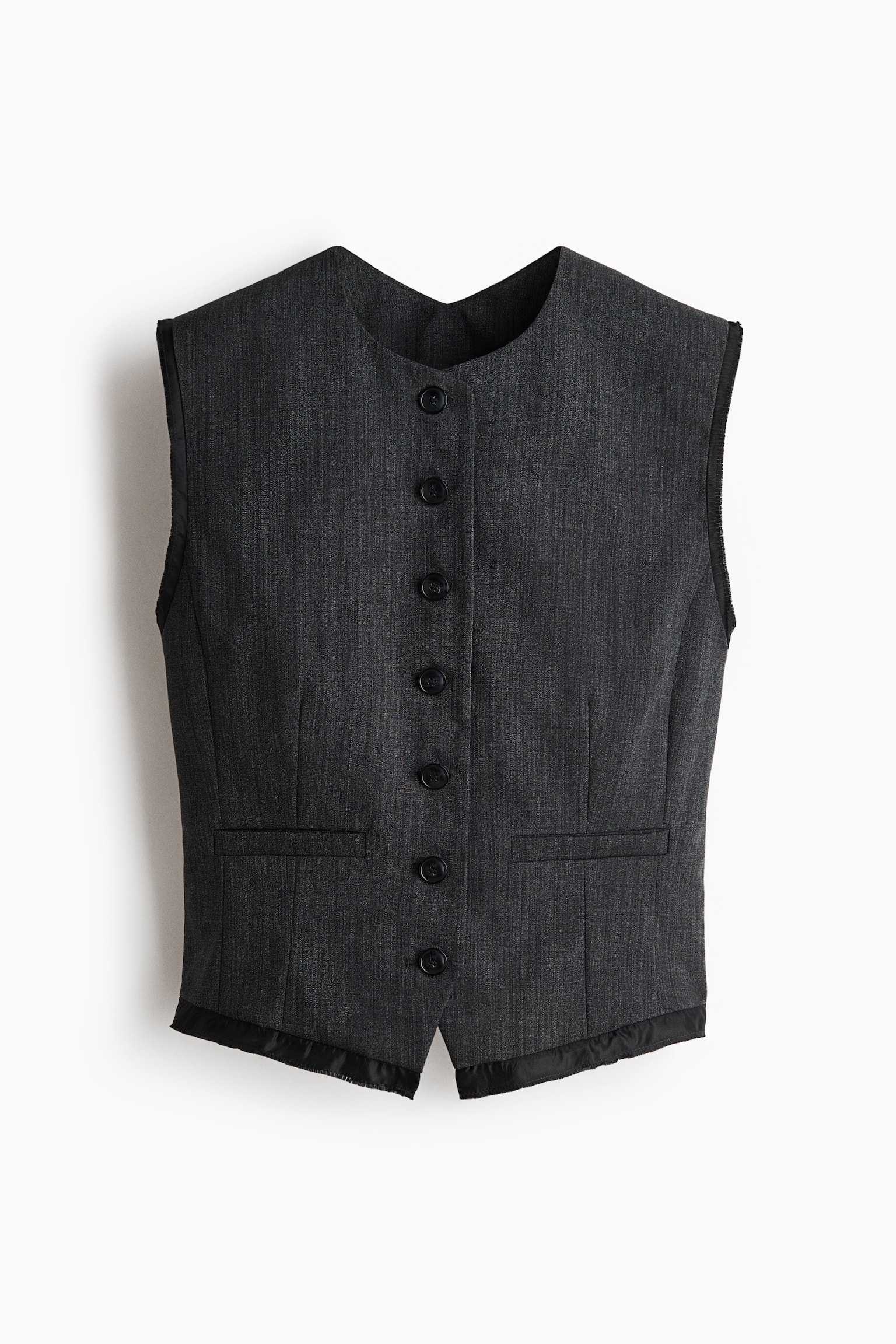 A dark gray waistcoat is facing forward, featuring a collarless scoop neckline and eight black buttons down the center front. Two horizontal welt pockets are visible, and black satin trim is detailing the armholes, neckline, button placket, and pointed front hem. - 1