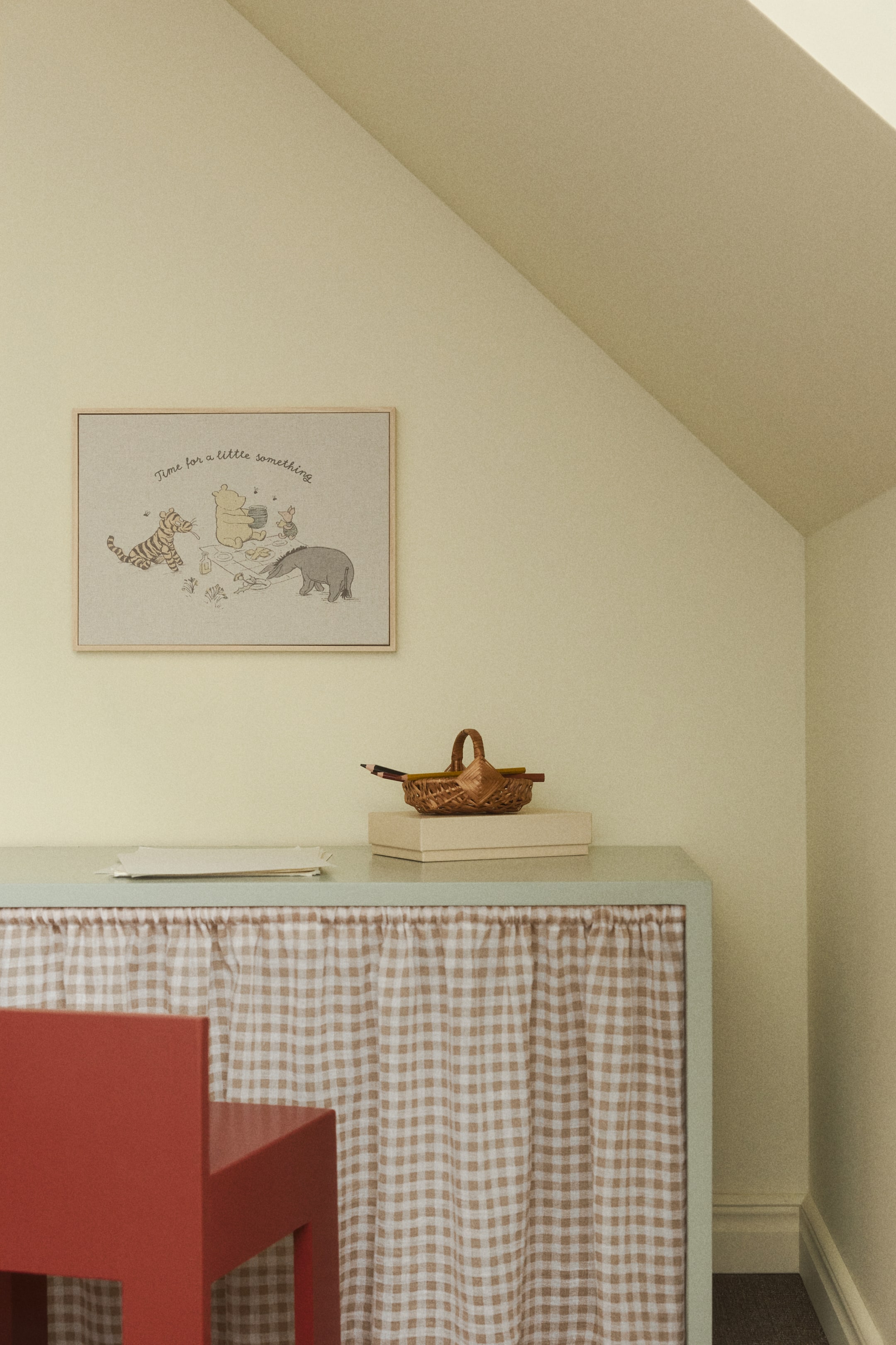 View larger image: A light blue rectangular cabinet features a gathered light brown and white gingham check curtain across its front. A light-colored box rests on its top surface.