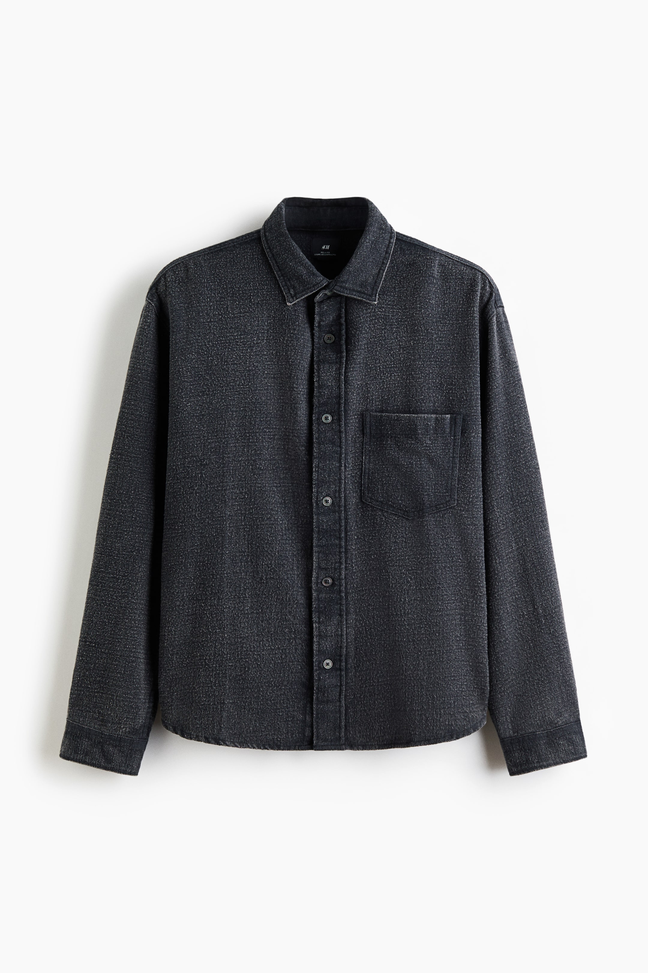 View larger image: A dark grey textured shirt is shown front-facing, featuring a classic collar, a full button-down placket, and a single patch pocket on the left chest. It is displaying long sleeves with buttoned cuffs and a rounded hem.