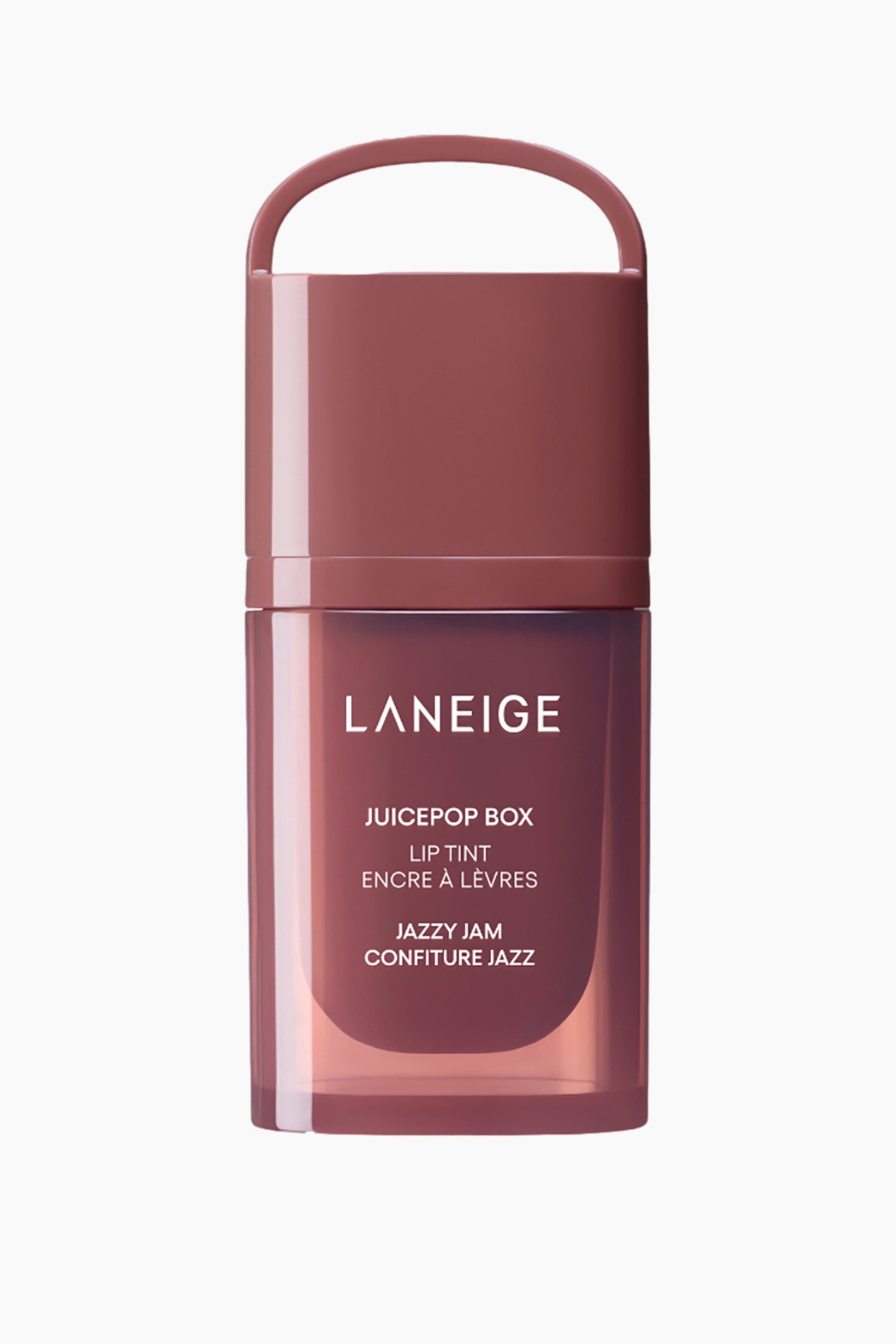 Visa större bild: Laneige Juicepop Box Lip Tint i Jazzy Jam presenteras i en rektangulär behållare, med ett ogenomskinligt, ros-brunt topplock med ett integrerat ögla-handtag och en genomskinlig, ljusare ros-brun bottensektion. Varumärkesnamnet och produktdetaljerna visas i vitt på framsidan av den genomskinliga sektionen.