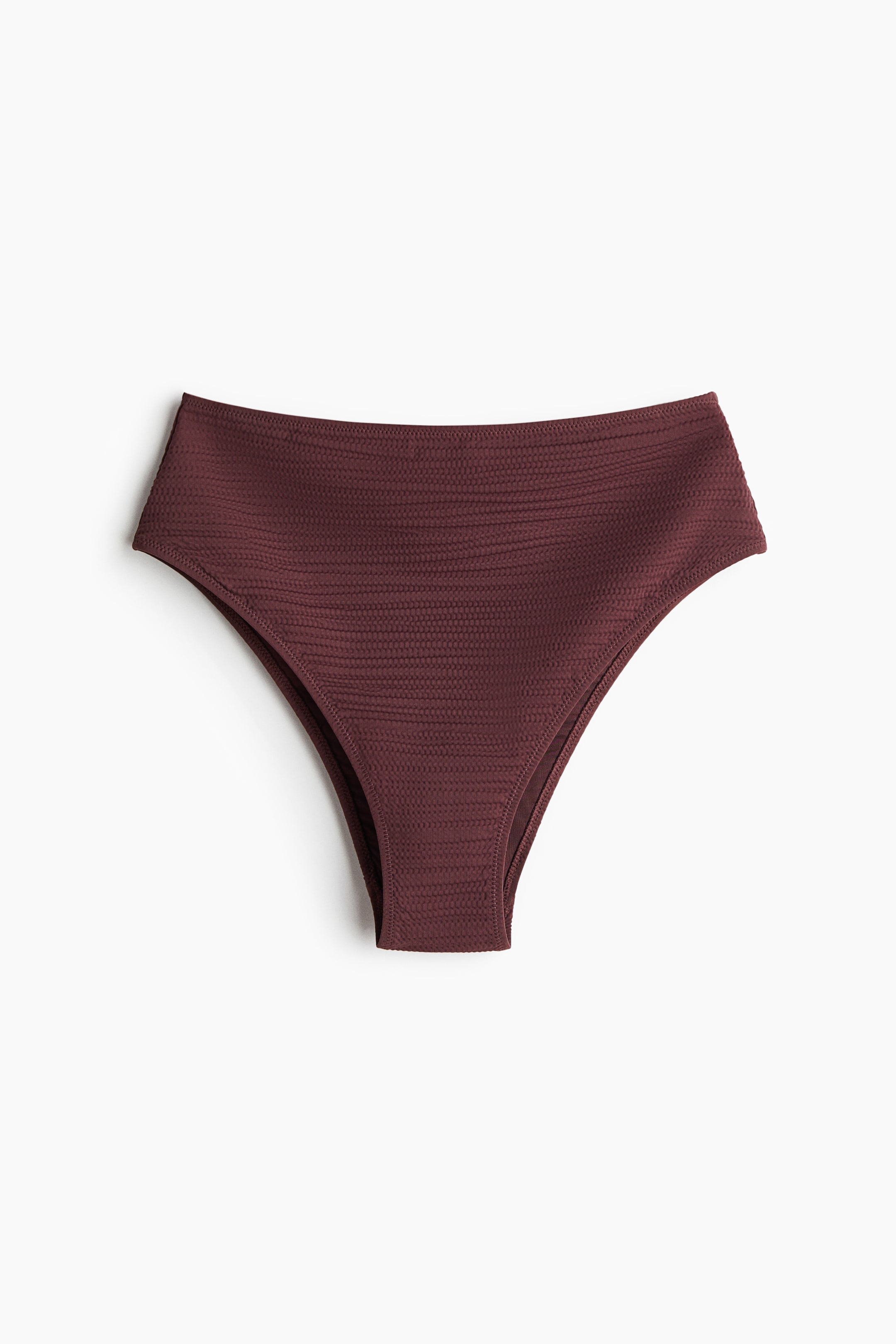 Visualizza immagine più grande: Le parti inferiori del bikini, viste frontalmente, presentano una vita alta e una sottile texture orizzontale in un intenso color bordeaux.