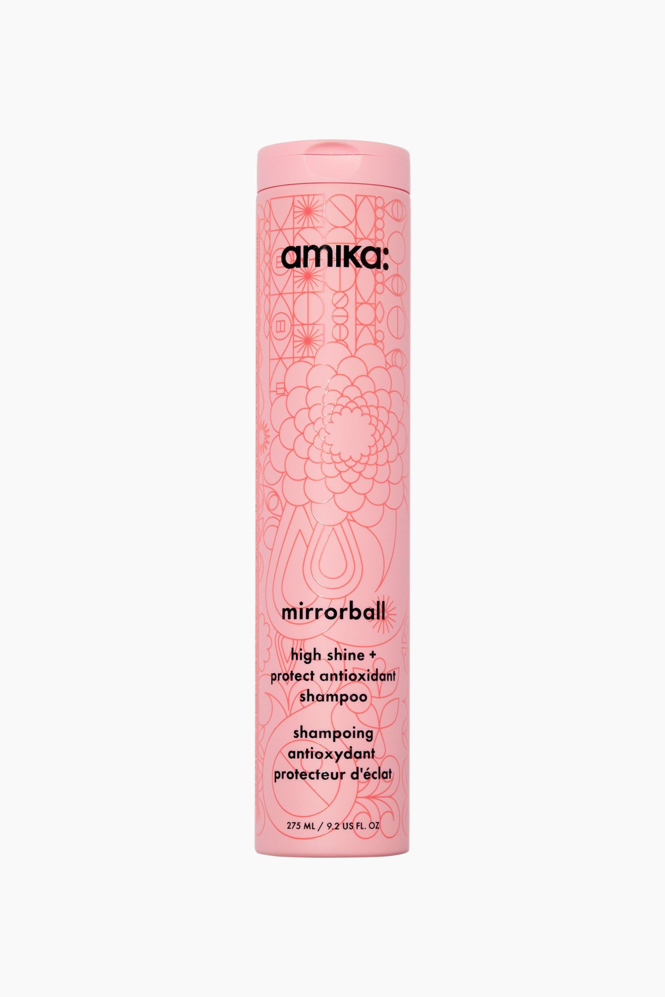 Visa större bild: En hög, cylindrisk rosa flaska med amika Mirrorball Shampoo står upprätt och vänd framåt. Flaskan visar intrikata, lätt upphöjda rosa blommönster och geometriska mönster över hela ytan, med svart text som visar varumärkesnamnet och produktinformationen.