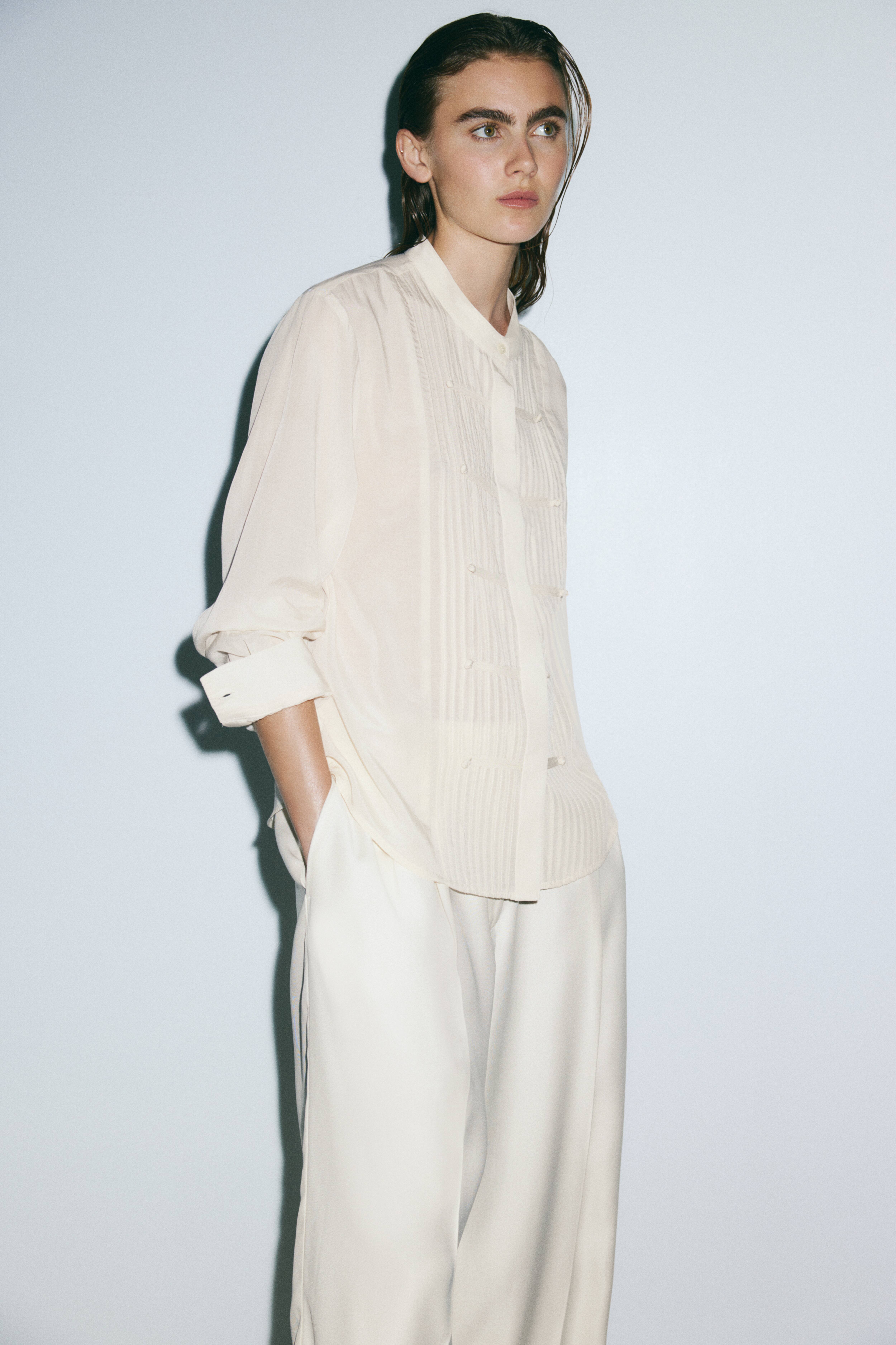 Blouse à boutons avec plis nervure