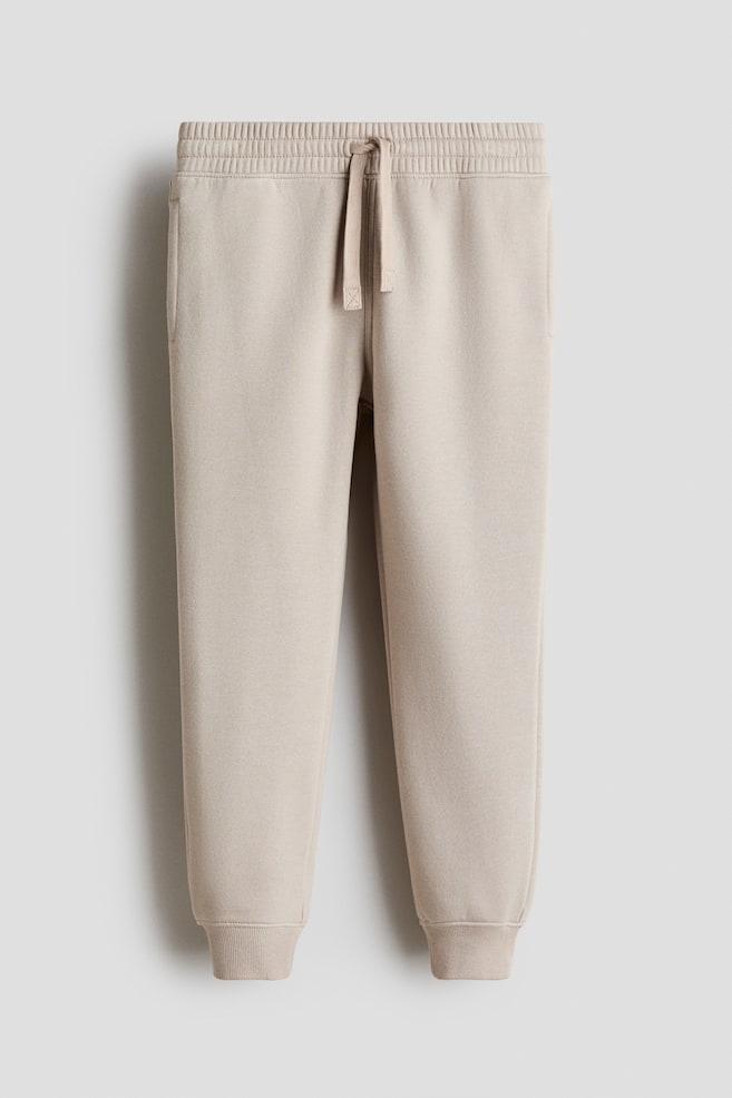 Joggers em tecido moletão de algodão - Bege claro/Verde escuro/Preto/Azul/Cinzento claro mesclado/Azul marinho/Turquesa pó/Bege mesclado/Azul pó - 1