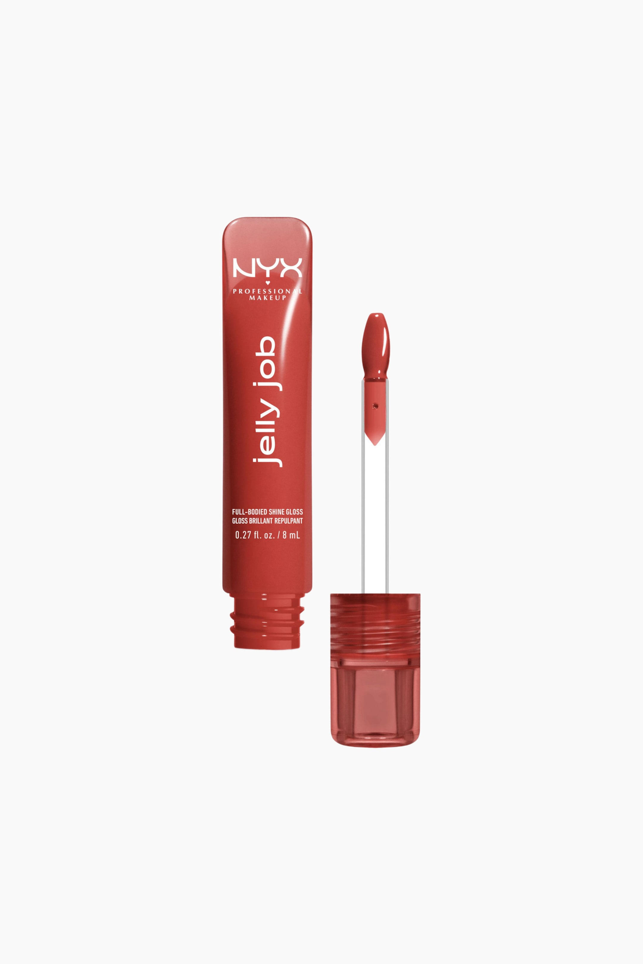Se større billede: Et koralrødt NYX Jelly Job lipglossrør står oprejst med hætten fjernet og viser brandnavn og produktoplysninger. En applikator, dækket af samme gloss, er strakt ud til højre for det åbne rør, hvor gevindet er synligt.