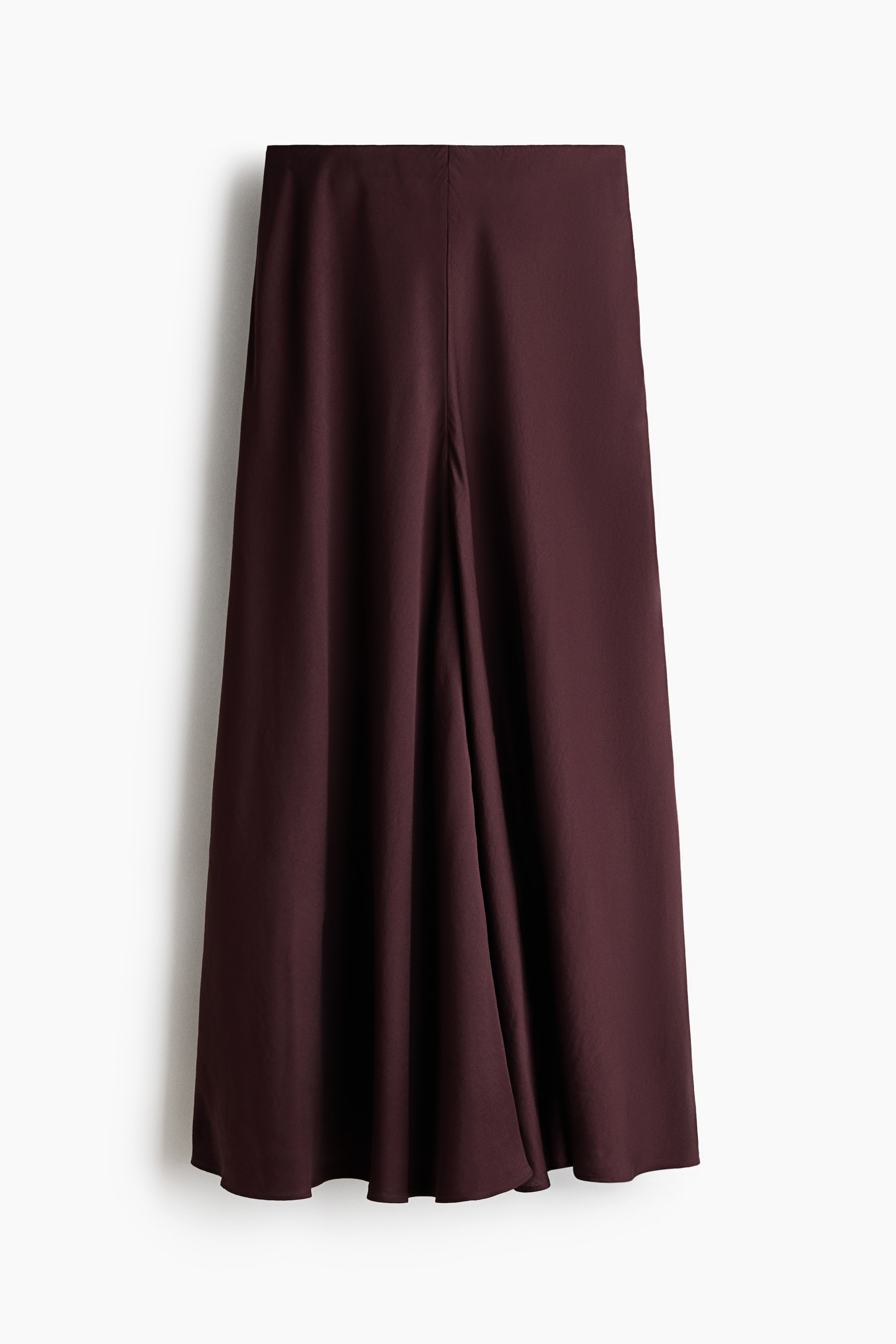 Voir une image plus grande: Une jupe midi bordeaux profond présente une ceinture plate et une silhouette fluide en ligne A. Une couture centrale s'étend le long du devant, créant un pli subtil qui ajoute du mouvement au tissu lisse.