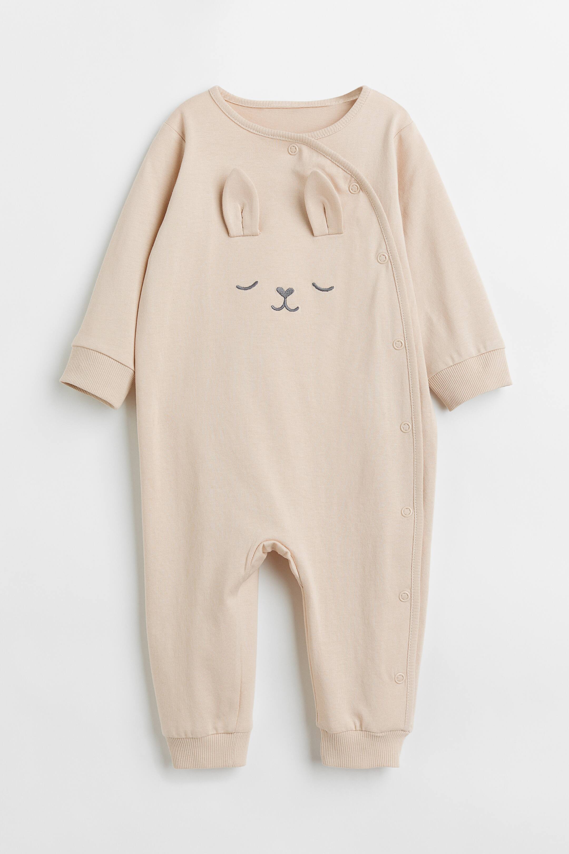 View larger image: Appliquéd all-in-one pyjamas - Powder beige/Rabbit - Kids | H&M 1