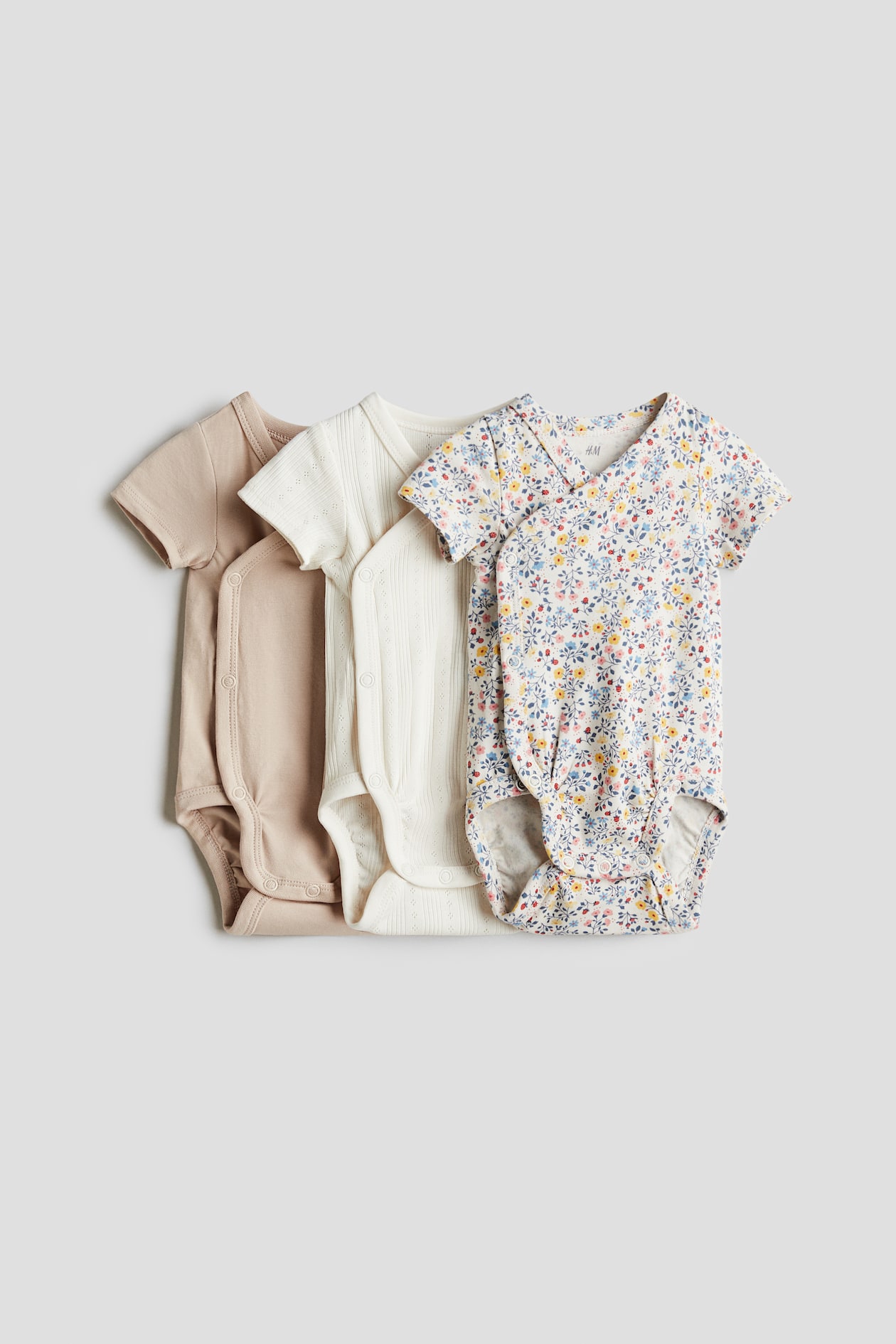 Body incrociati pezzi Bianco/fiori BAMBINO H&M CH