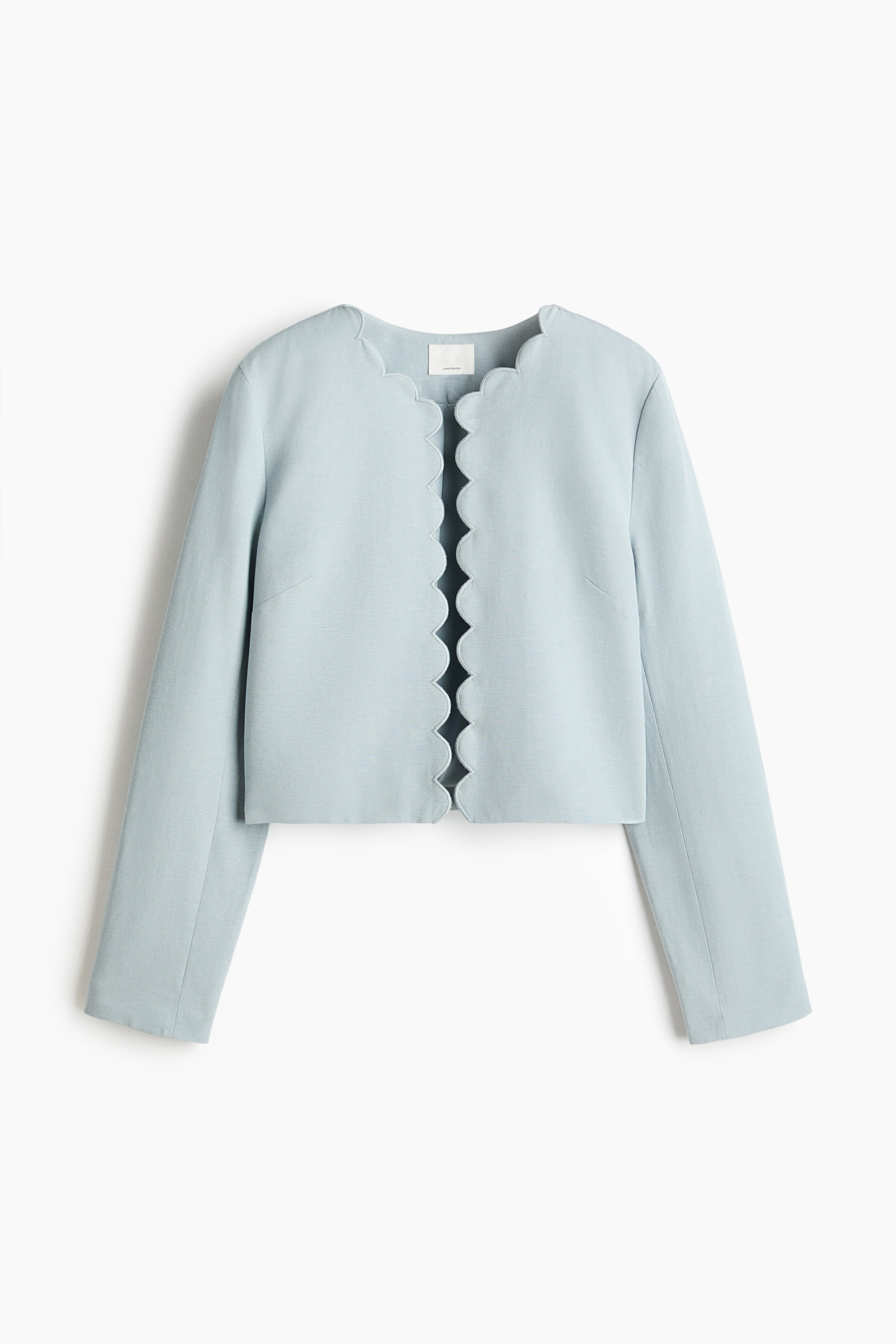 View larger image: "A light blue jacket in woven fabric is showcasing its front view, featuring a round neckline and an open front, both adorned with scalloped edges."