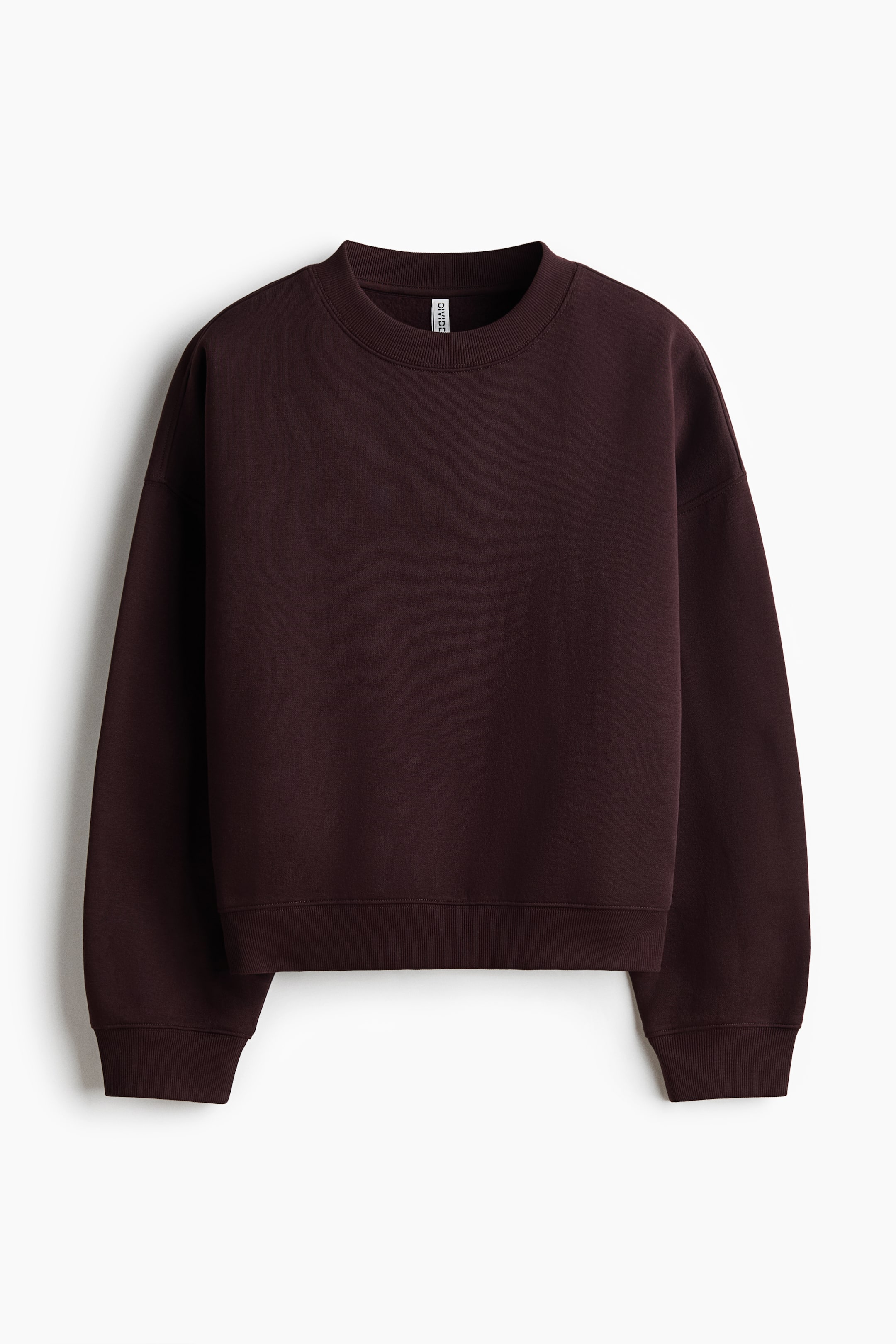 View larger image: A dark maroon oversized sweatshirt is shown front-facing. It features a round ribbed neckline, dropped shoulders, long sleeves, and ribbed cuffs and hem.