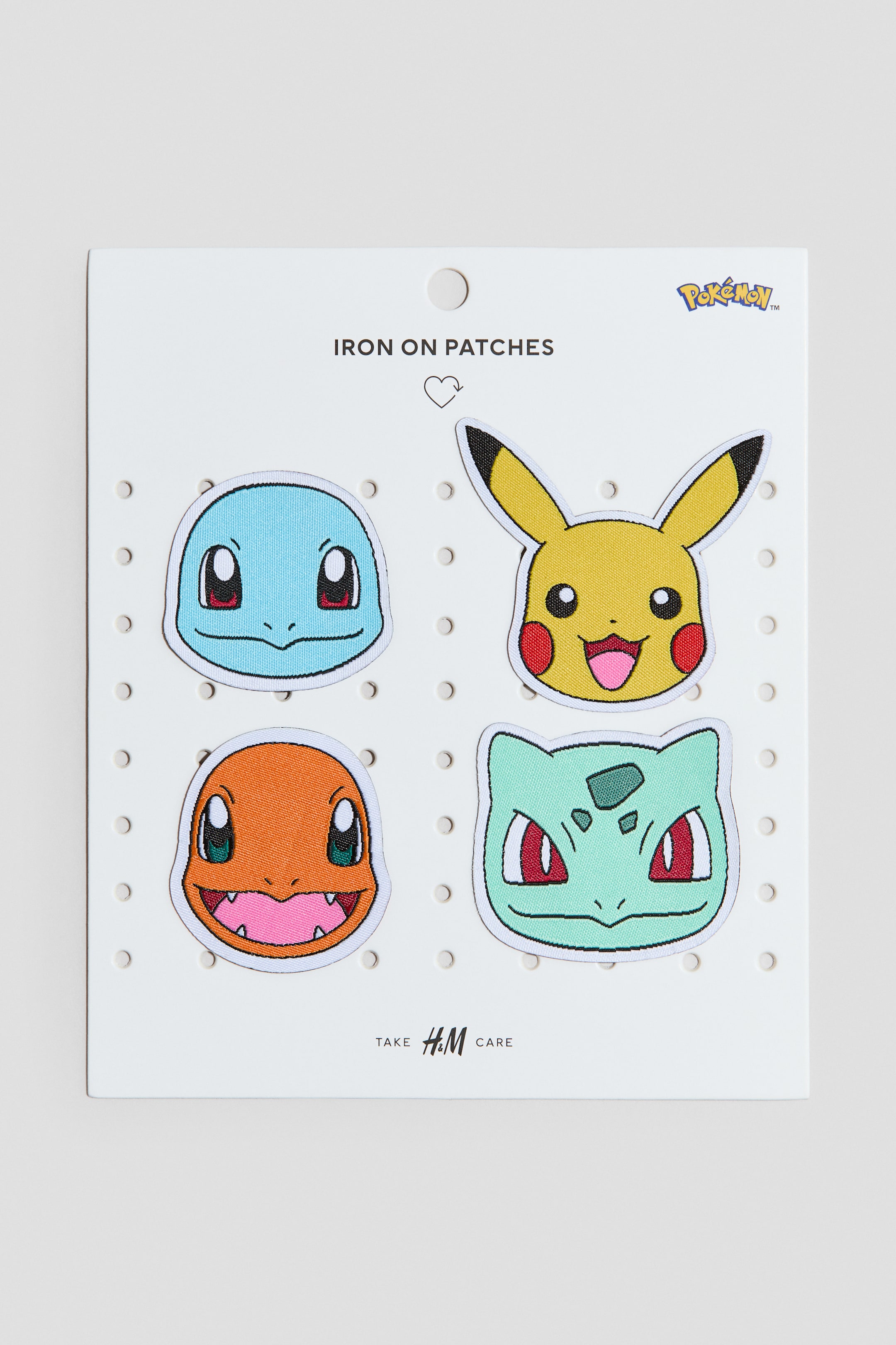 View larger image: Iron-on patches featuring four embroidered Pokémon character heads, including Squirtle, Charmander, Pikachu, and Bulbasaur. Each patch displays distinct colours, black outlines, and varying sizes, presented flat on a white backing card.