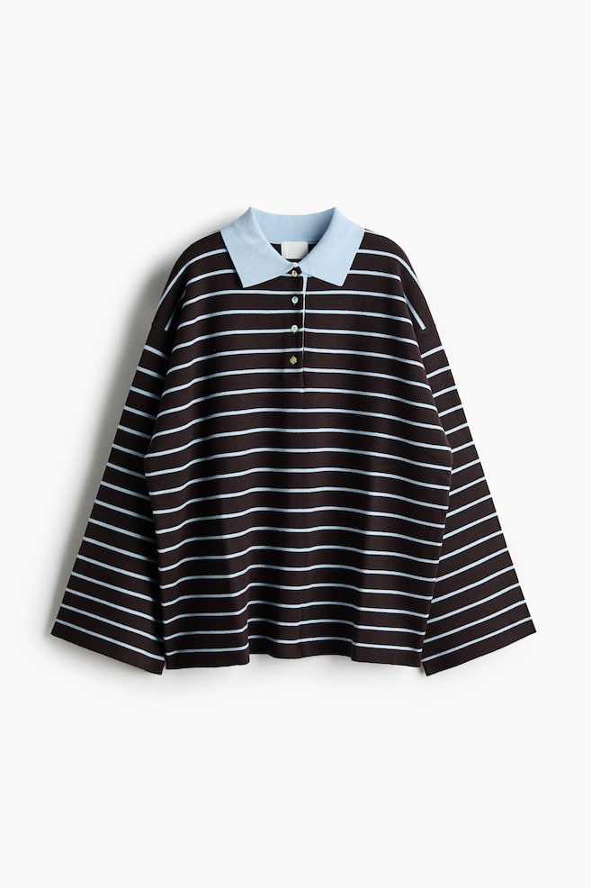 Oversized polo shirt is facing front, featuring a dark brown knit body with thin, horizontal light blue stripes and a contrasting light blue collar. The shirt is displaying a four-button placket, dropped shoulders, and wide, long sleeves with open cuffs. - 1