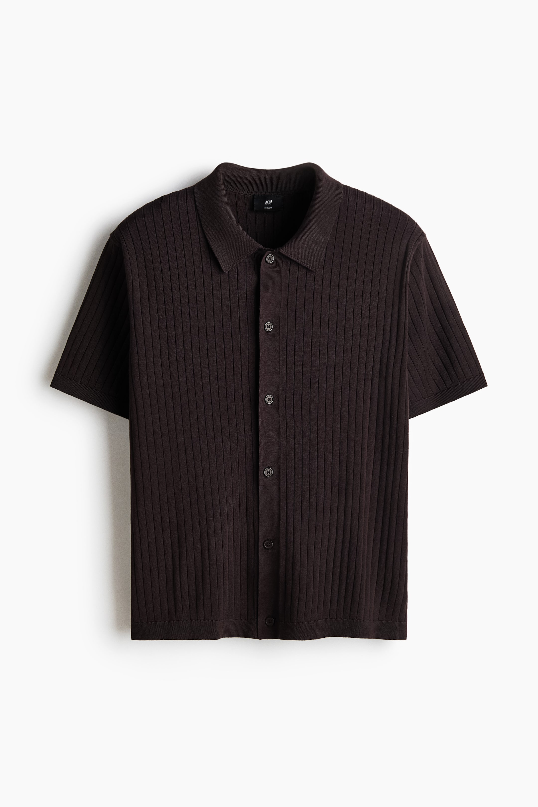 View larger image: A dark brown ribbed knit shirt is displaying a collar and buttons down the front. It features short sleeves and a straight-cut hem, presenting a regular fit from the front.