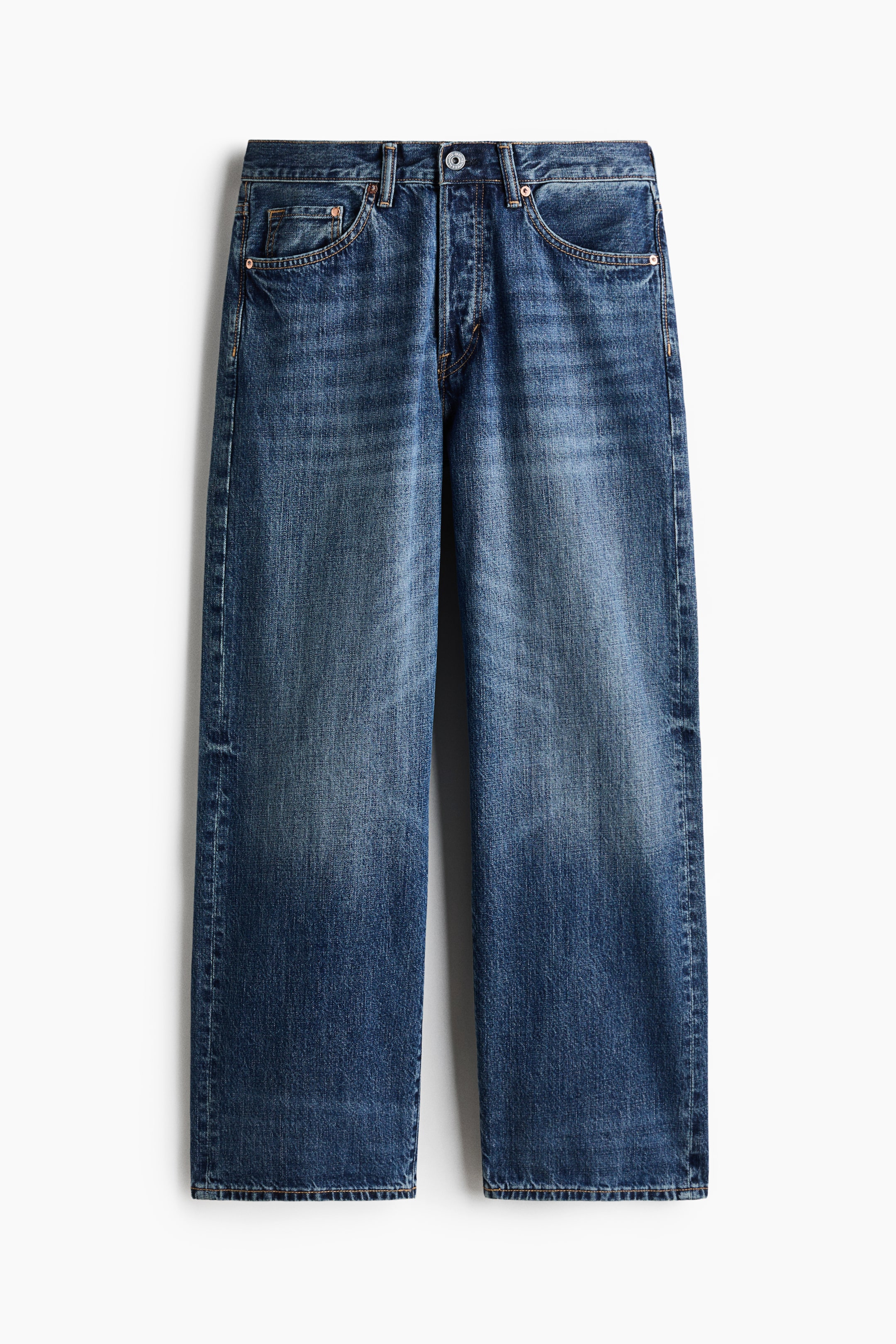 View larger image: Blue denim jeans showcase a relaxed, straight-leg fit with a washed finish. They feature a button fly fastening, five-pocket styling, and visible contrast stitching.