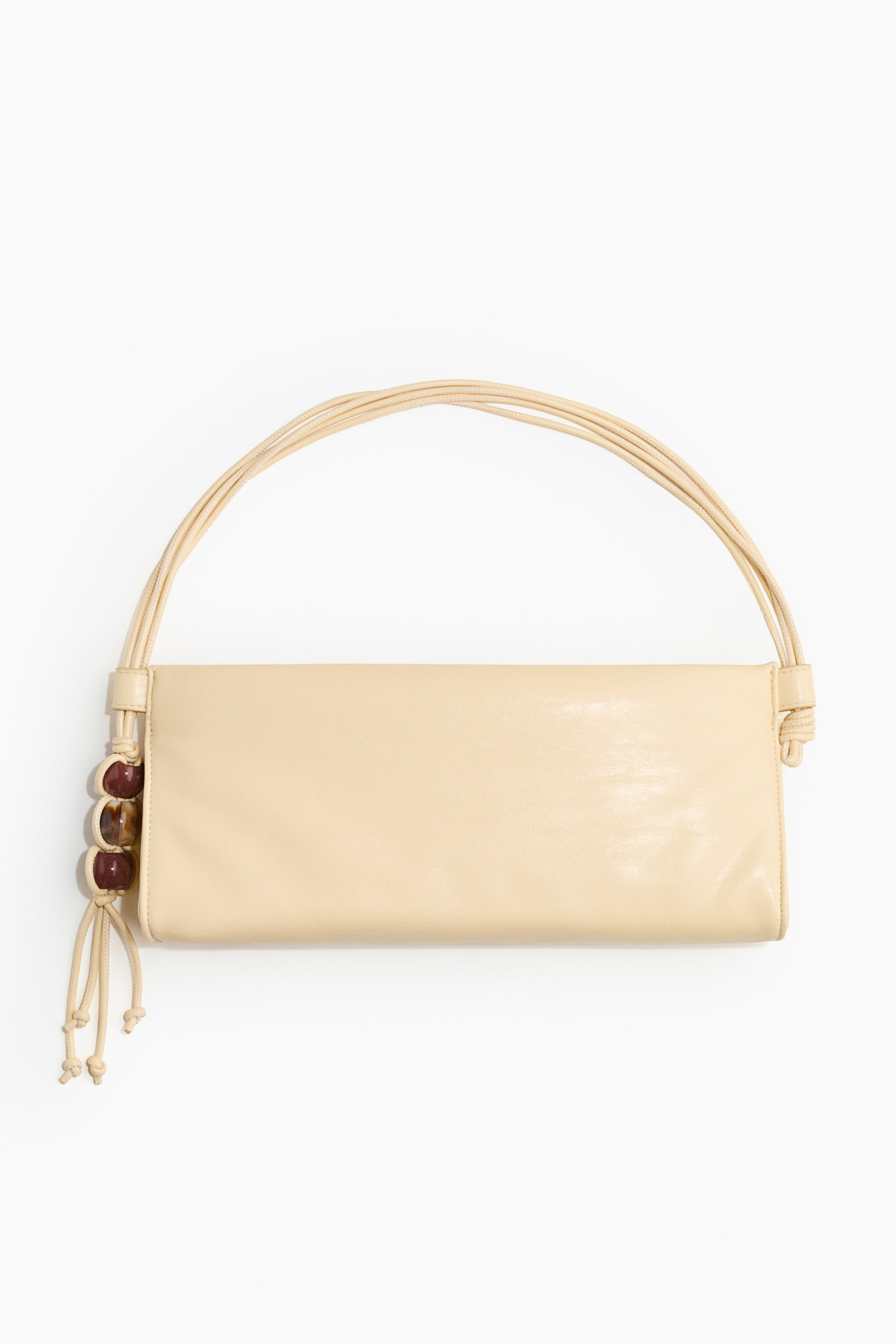 View larger image: A rectangular cream-colored clutch is facing FRONT and is featuring a multi-strand handle. The handle's left side is adorned with three polished, irregularly shaped beads in brown and amber tones, while the right side is secured by a simple knot.