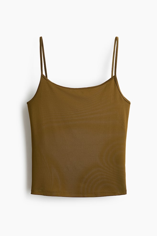 A dark olive green camisole top is displaying its FRONT, featuring thin spaghetti straps, a scoop neckline, and a plain, smooth fabric with a neatly hemmed bottom edge. - 1