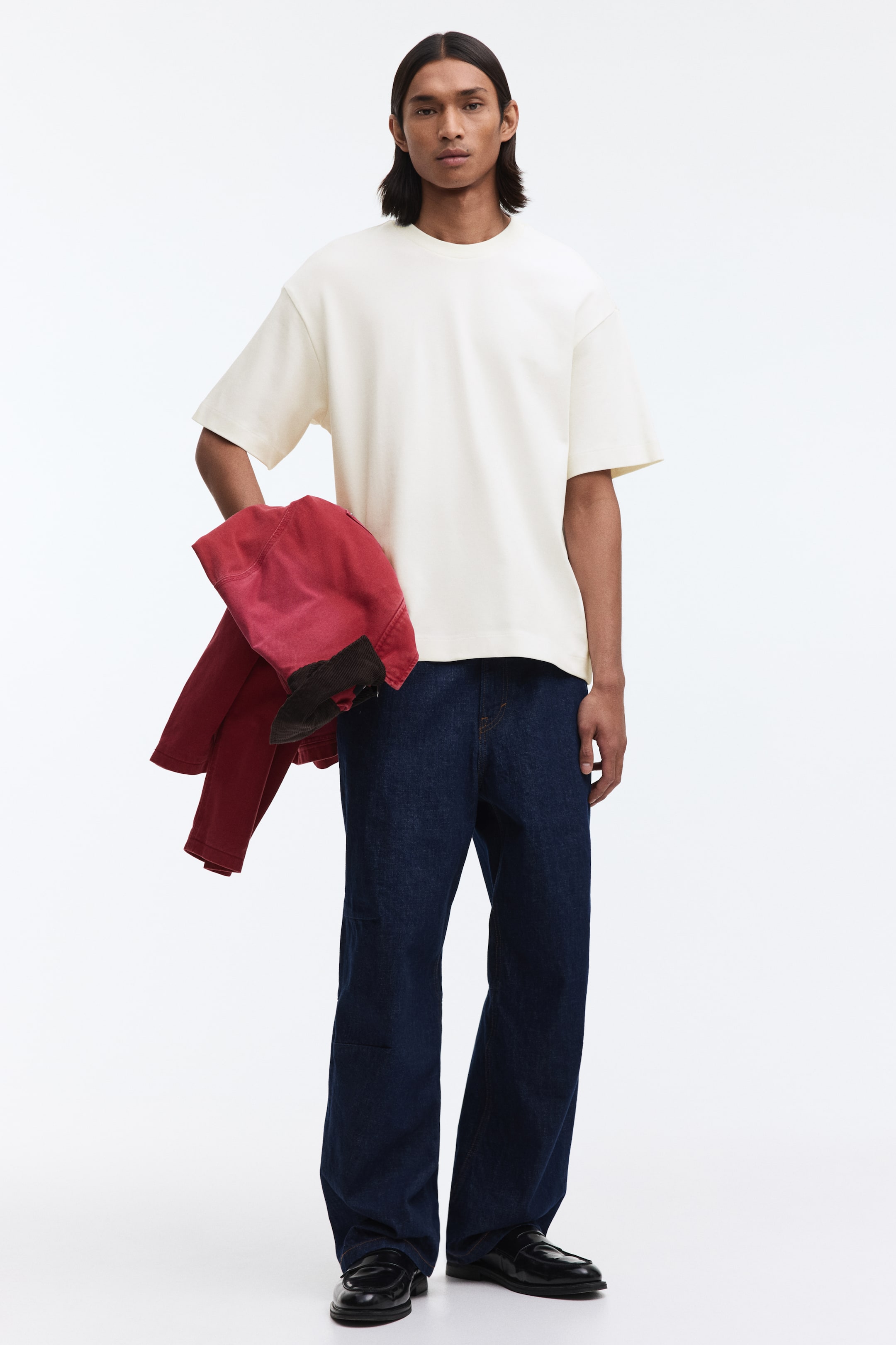 View larger image: An off-white, oversized t-shirt featuring a crew neck, dropped shoulders, and wide short sleeves, presenting a relaxed fit from the front.