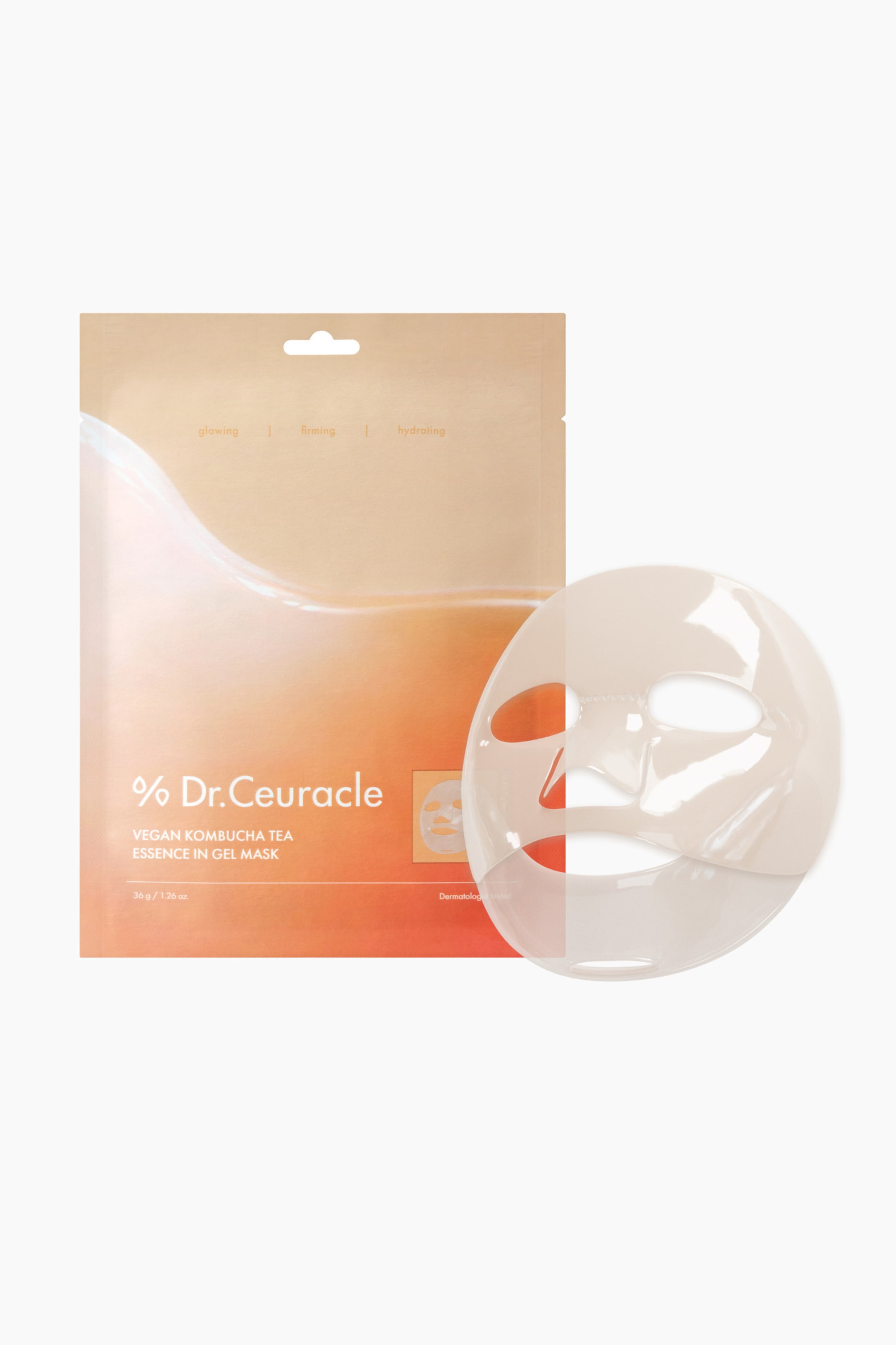 Größeres Bild ansehen: Eine Dr. Ceuracle vegane Kombucha-Tee-Essenz in Gelmaske wird neben ihrer rechteckigen, beige und orangefarbenen Verpackung präsentiert. Die durchscheinende, gesichtsgeformte Gelmaske verfügt über Aussparungen für die Augen, die Nase und den Mund und liegt leicht nach rechts geneigt, wodurch ihre Form sichtbar wird.