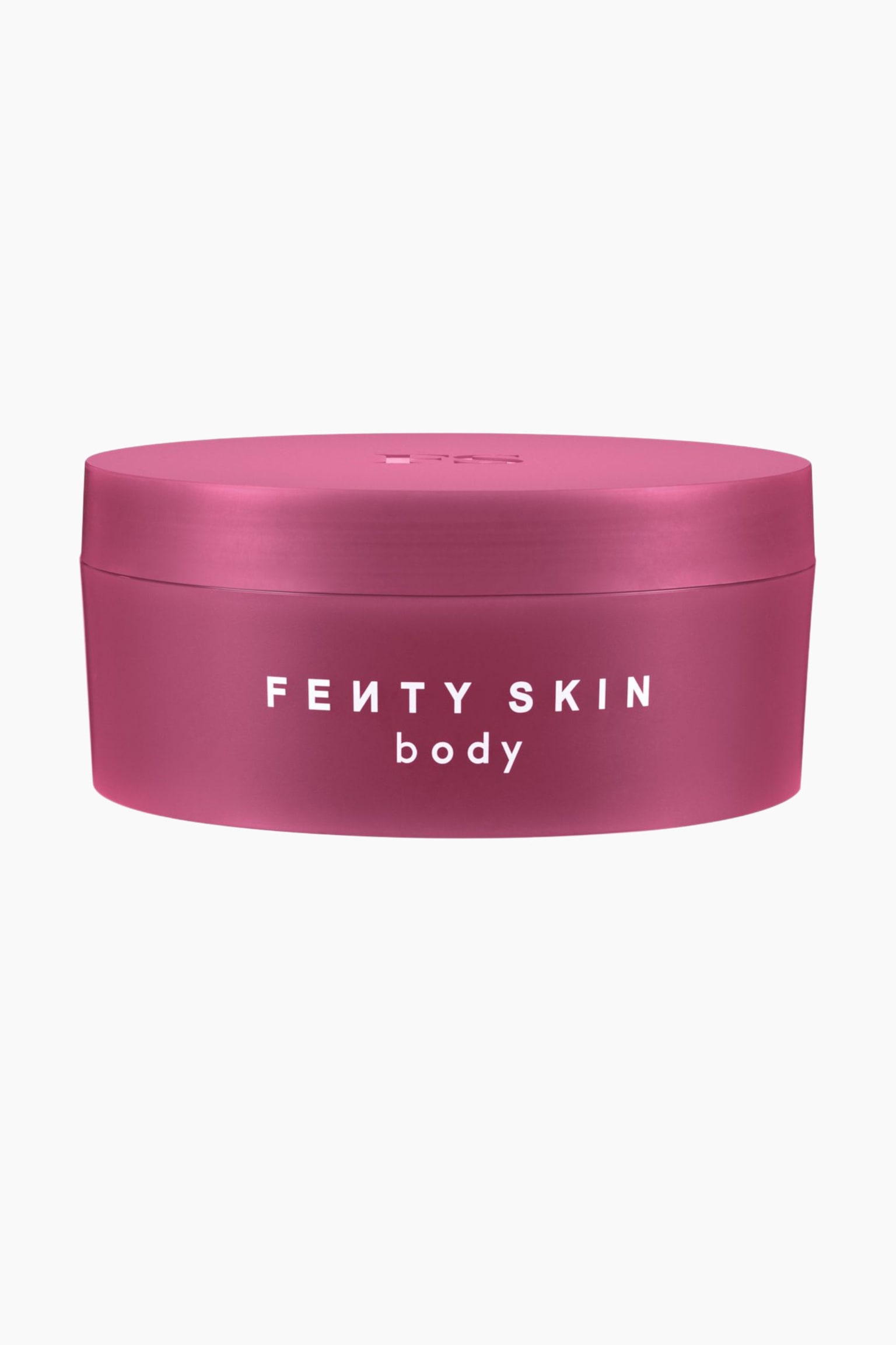 Butta Drop Whipped Oil Body Cream stÃ¥r upprÃ¤tt i en cylindrisk, matt magentafÃ¤rgad burk med ett matchande platt lock. Framsidan av burken visar den vita texten âFENTY SKIN bodyâ i ett rent sans-serif-typsnitt.
