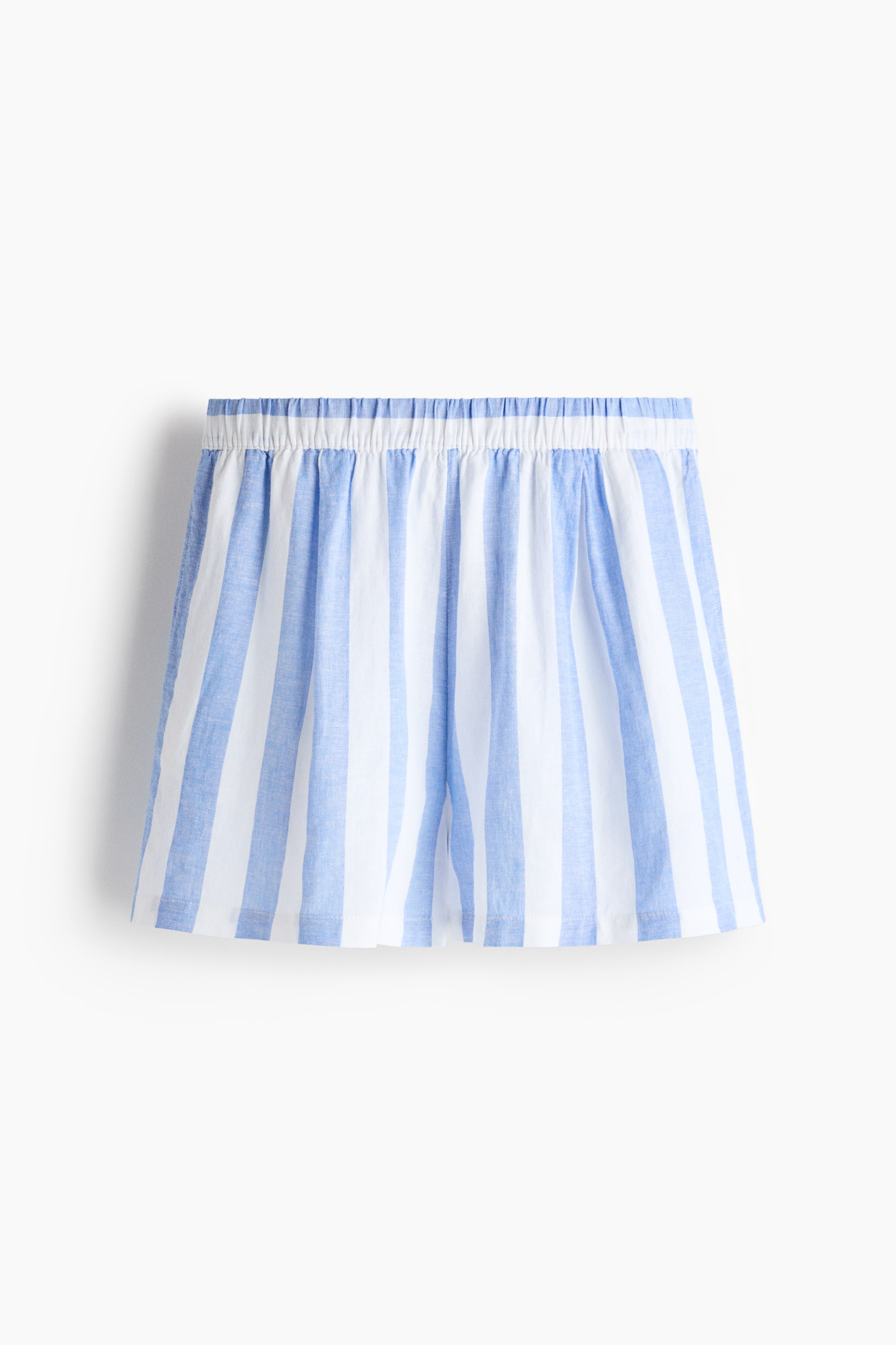 View larger image: The shorts showcase blue and white vertical stripes, featuring an elasticated, gathered waistband and a loose, short fit.