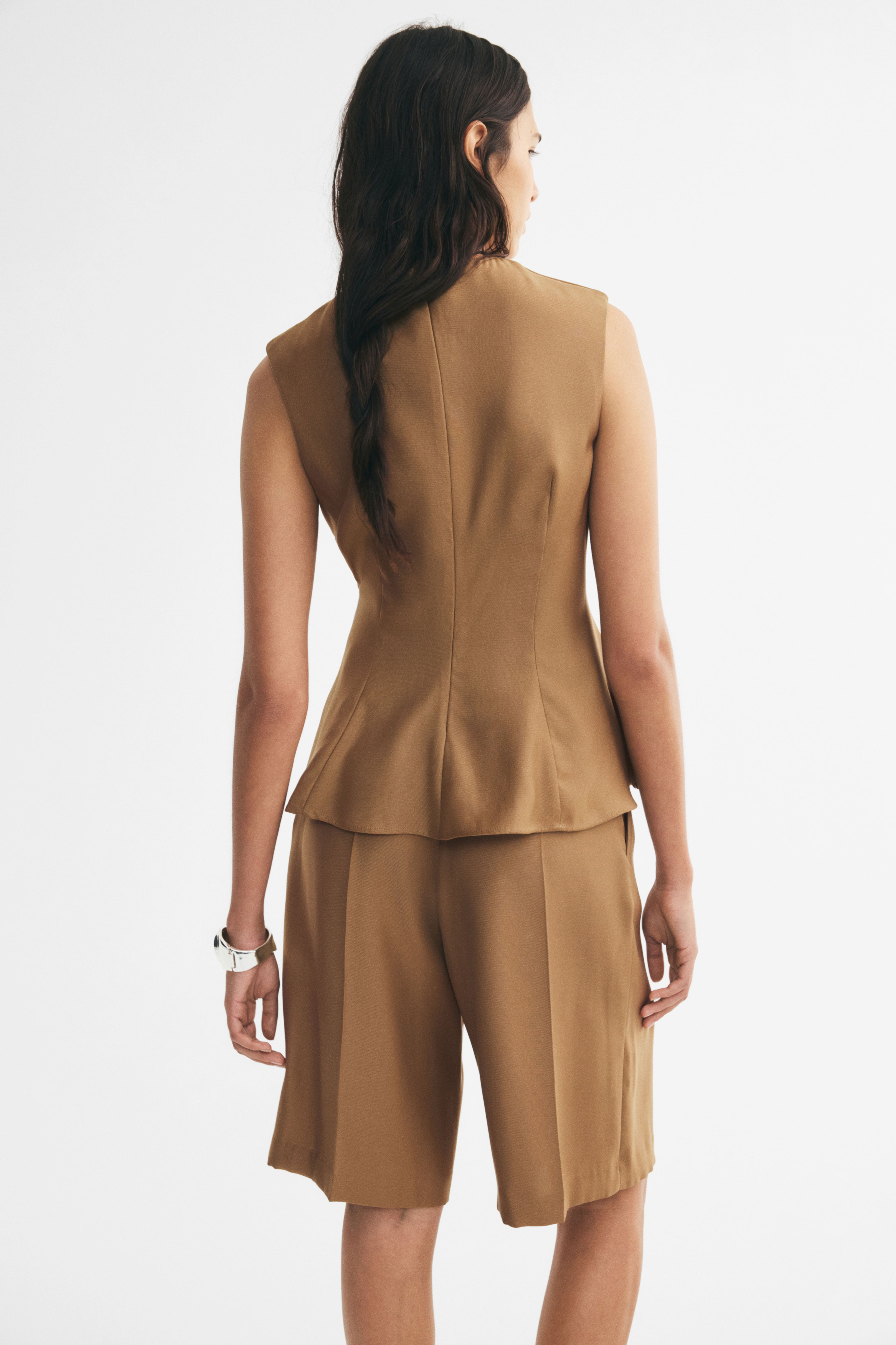 Sleeveless Peplum Top