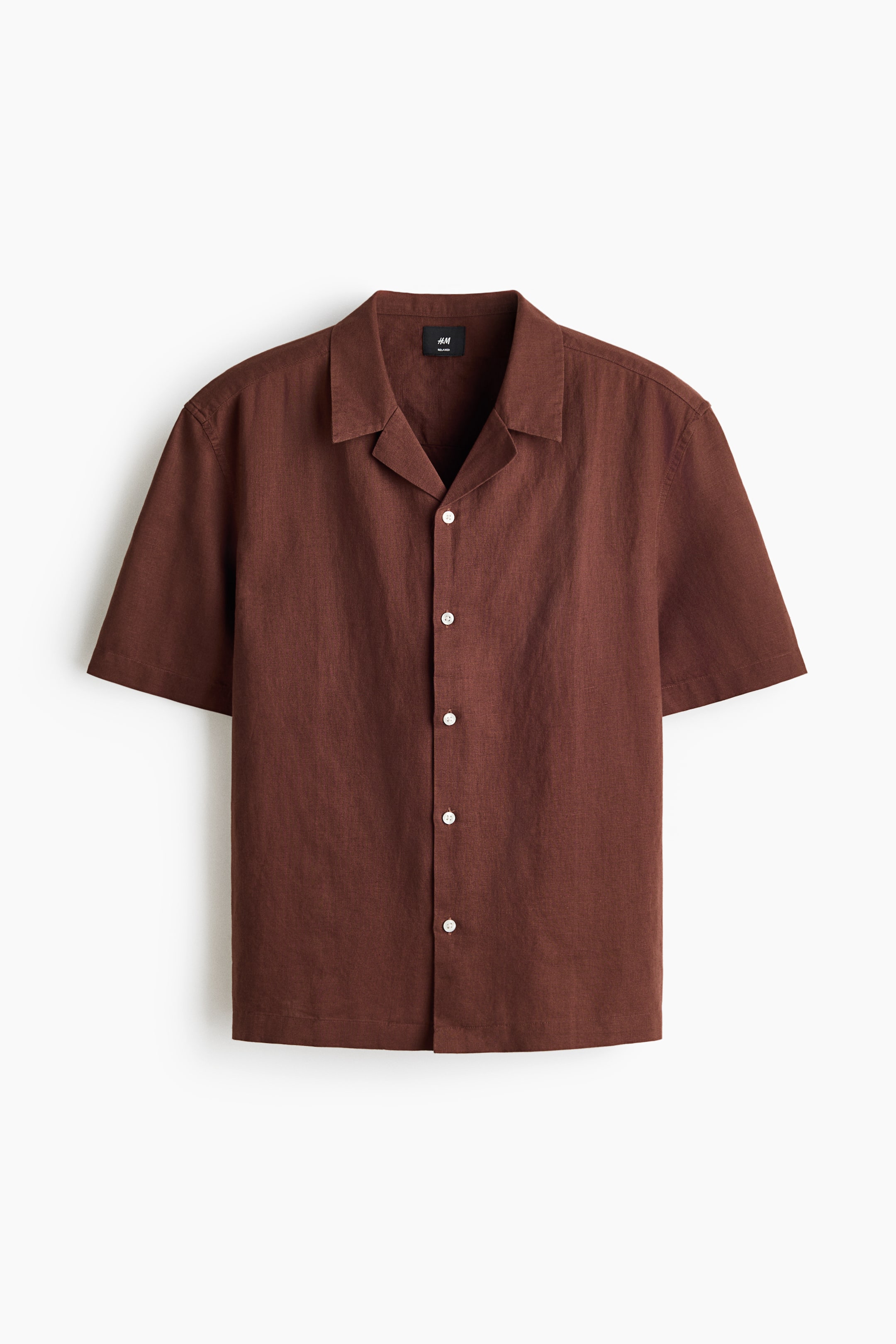 View larger image: This brown short-sleeve shirt is shown from the front. It features a resort collar, a French front with visible white buttons, a textured weave, a relaxed fit, and a straight-cut hem.