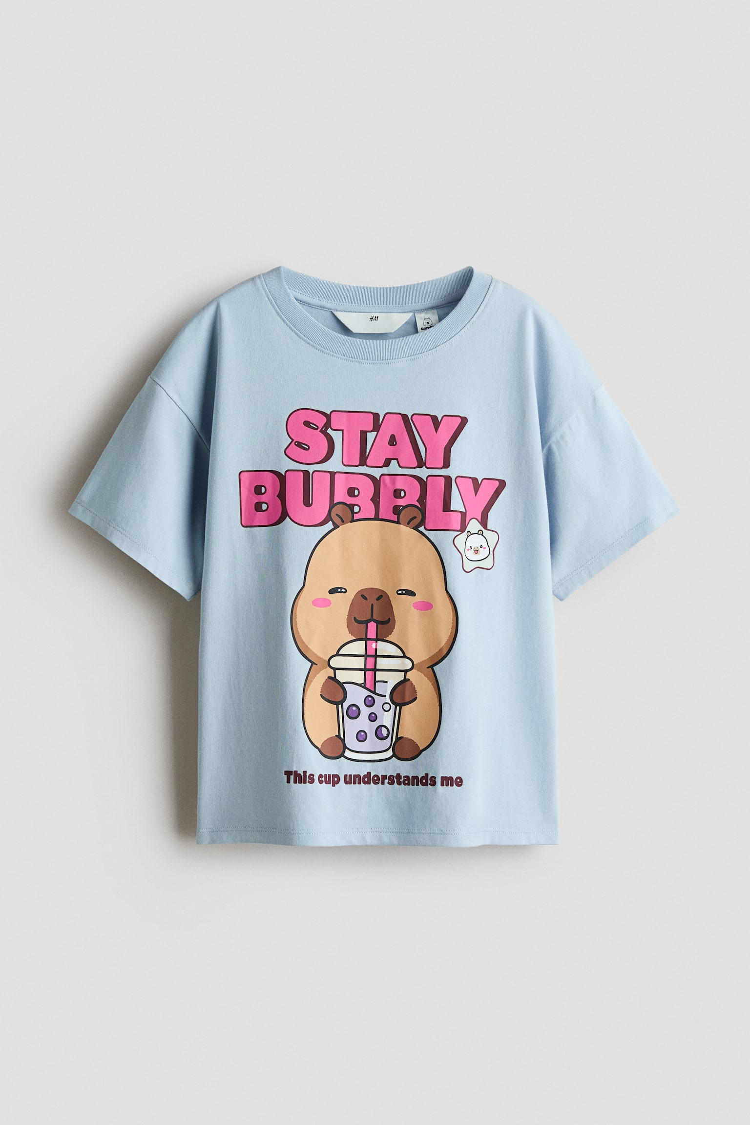 Katoenen T-shirt met print - Light dusty blue/CapyFun/Wit/Hello Kitty/Ivoorwit/SmileyWorld®/Lichtgeel/CapyFun/Wit/Pochacco/Dusty lichtblauw/Cinnamoroll/Zwart/KPop Demon Hunters/Roze/Lilo & Stitch/Lichtroze/Snoopy/Wit/KPop Demon Hunters