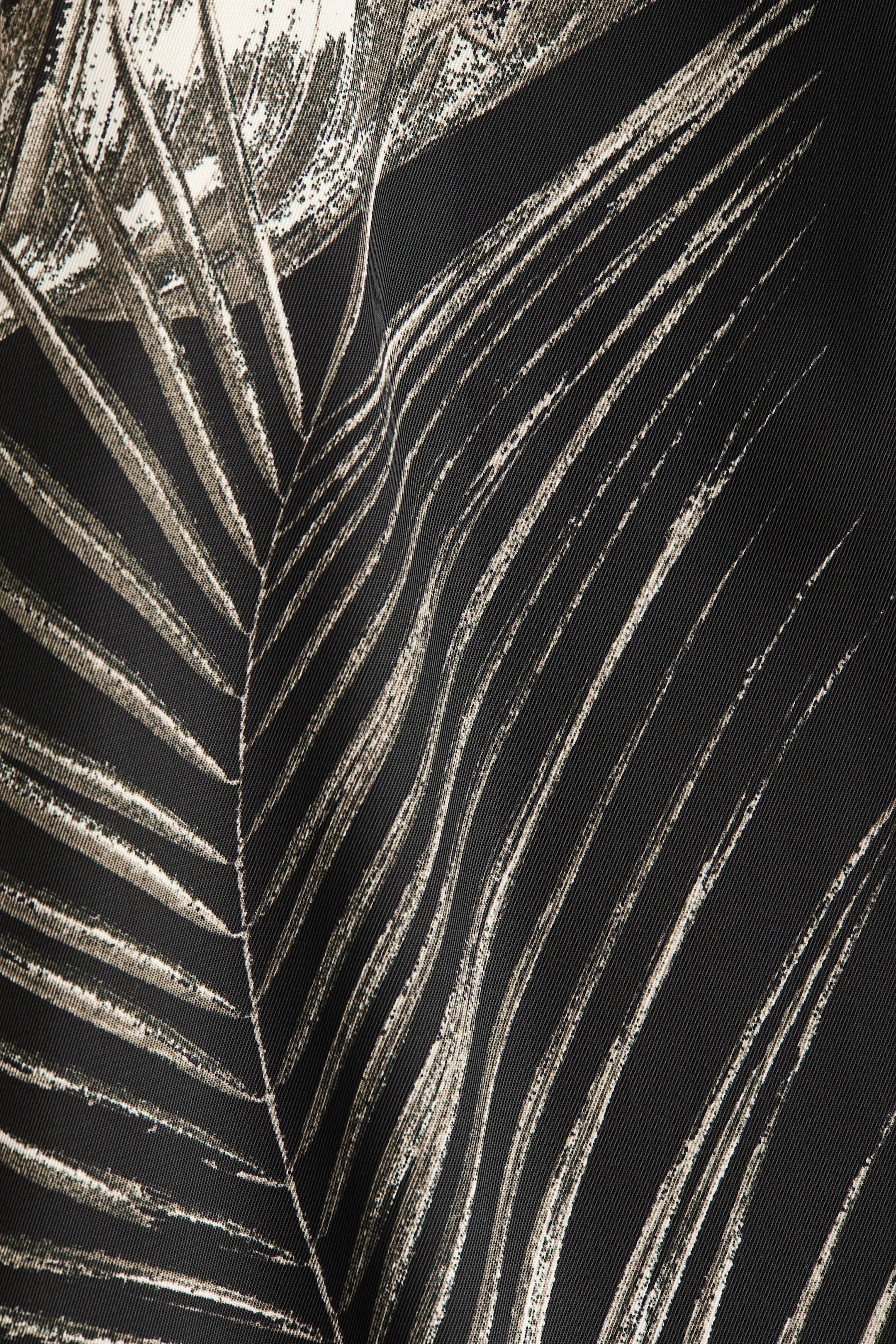View larger image: A black fabric is featuring a stylized botanical pattern. Light beige and off-white brushstroke lines are forming large fronds across the surface, while the fabric is presenting subtle folds and a fine diagonal weave.
