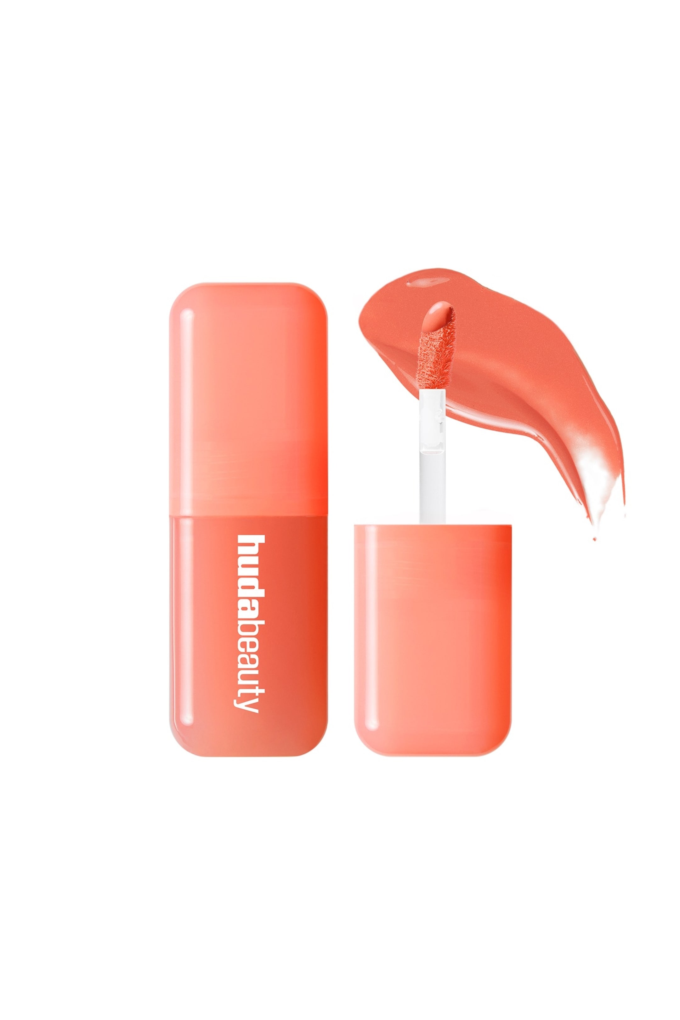 Näytä suurempi kuva: Suorakulmainen korallinoranssi huulikiilto putkilo pyöristetyillä kulmilla seisoo pystyssä, esittäen "hudabeauty" valkoisella tekstillä. Avoin vastaava putkilo esittelee flocked-applikaattorivarren, joka nousee esiin, kyllästettynä korallinoranssilla nestemäisellä tuotteella, jonka näyte levittäytyy sen viereen.