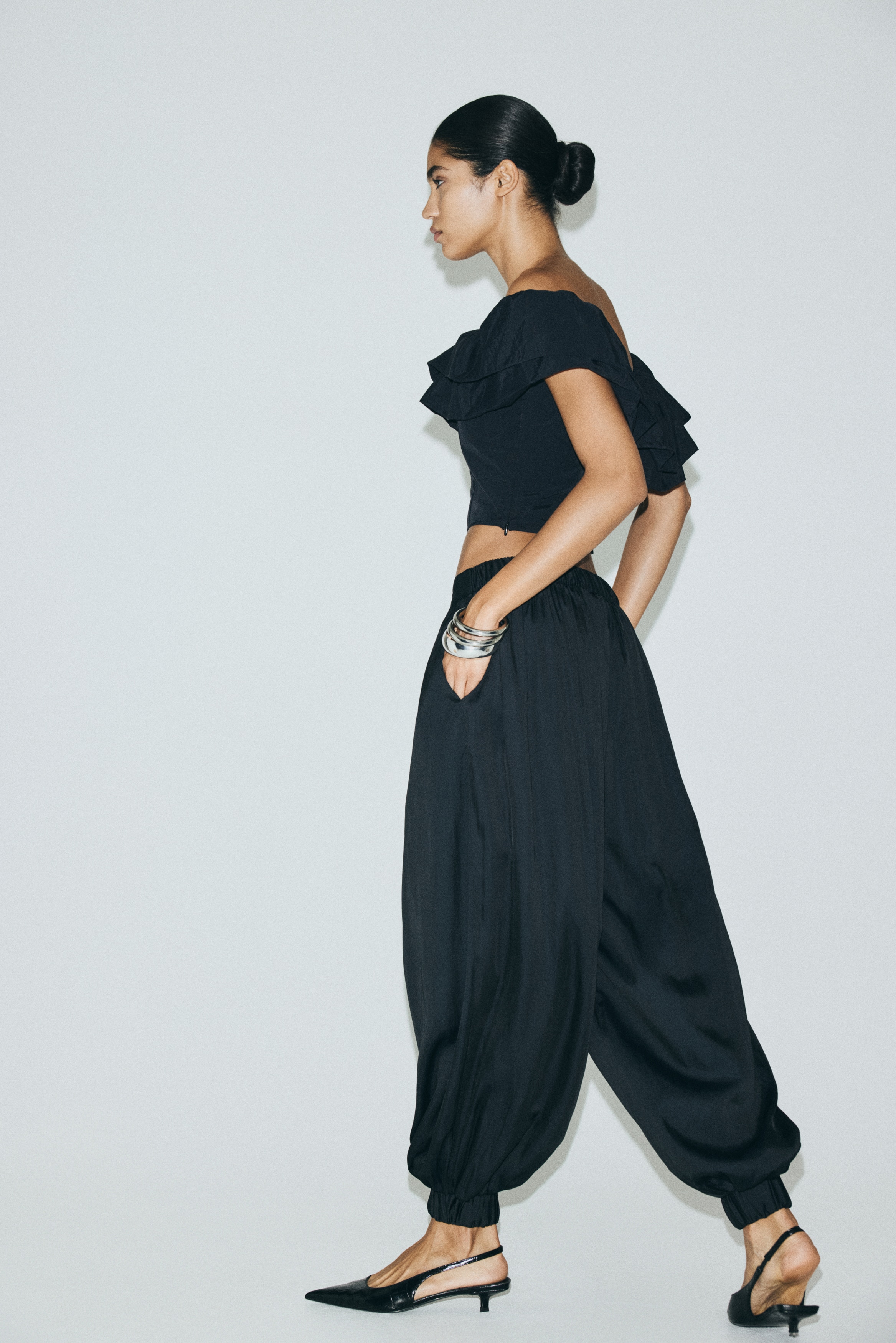 Frill-trimmed off-the-shoulder top