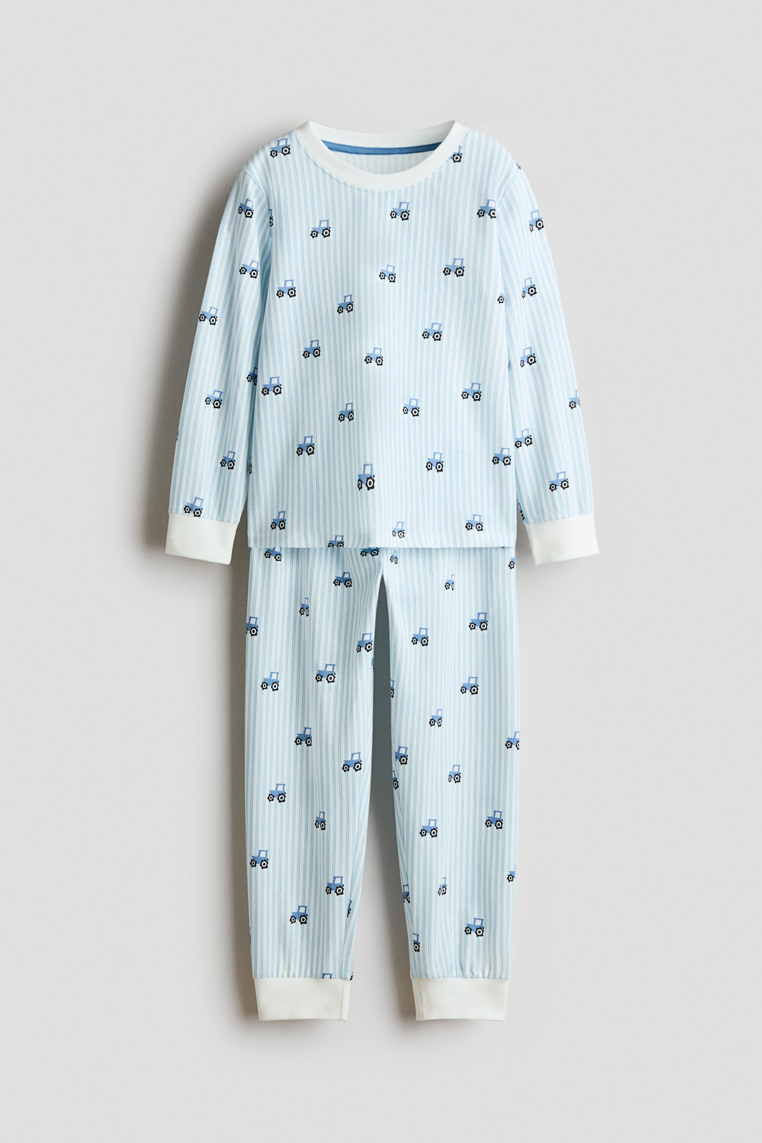 Printed cotton pyjamas - Világoskék/traktorok/Tengerészkék/Galaxy Travels/Krémszínű/járművek/Krémszínű/sztegoszauruszok/Tengerészkék/rakéták