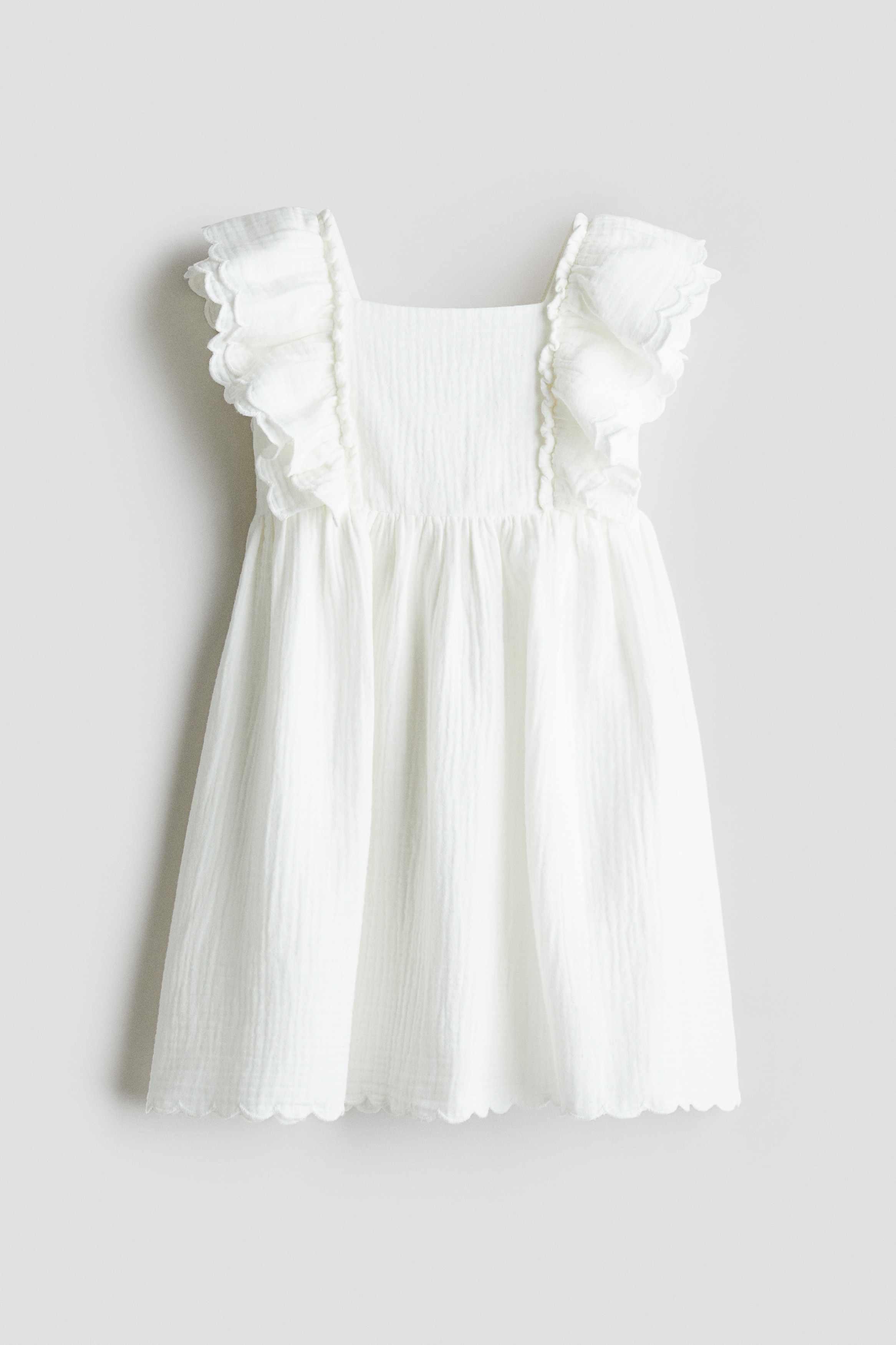 Kjole med bølgekant - Hvit