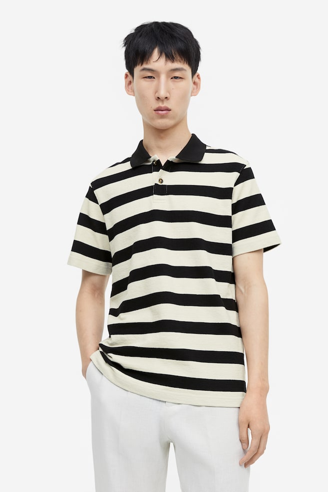 Poloshirt aus Frottee Relaxed Fit - Schwarz/Weiß gestreift - 1
