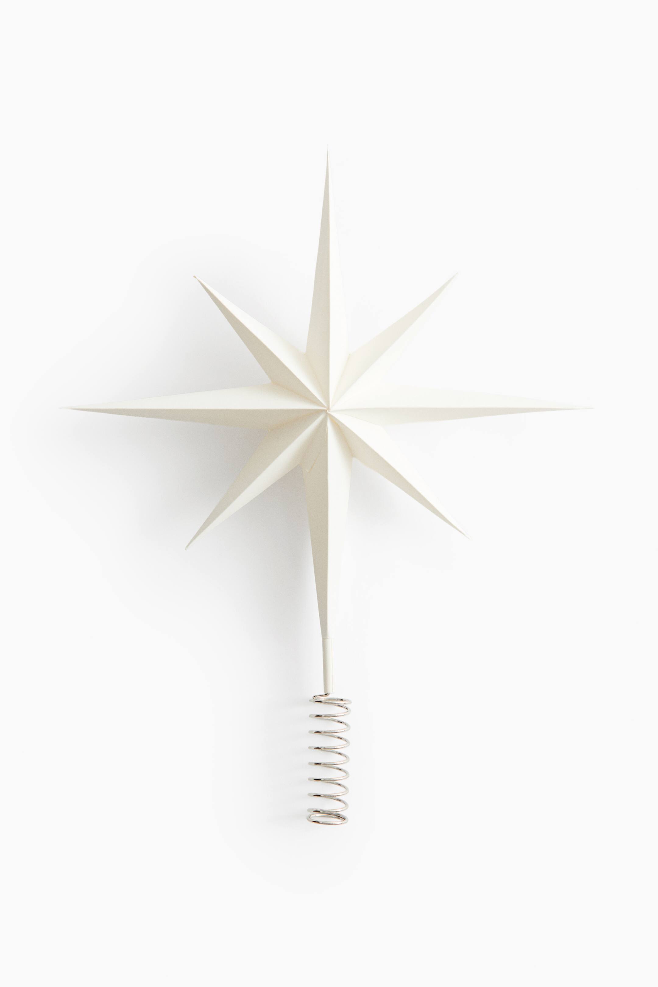 View larger image: An off-white star tree topper features a front-facing, eight-pointed faceted design with an elongated bottom point. The bottom point is attached to a silver-toned coiled metal spring base designed for mounting.