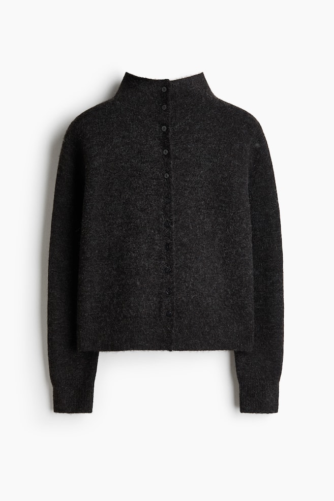 A charcoal grey fuzzy knit cardigan is facing front, featuring a high stand-up collar and a full button placket with six dark buttons. It is designed with long sleeves, ribbed cuffs, and a ribbed hem. - 1