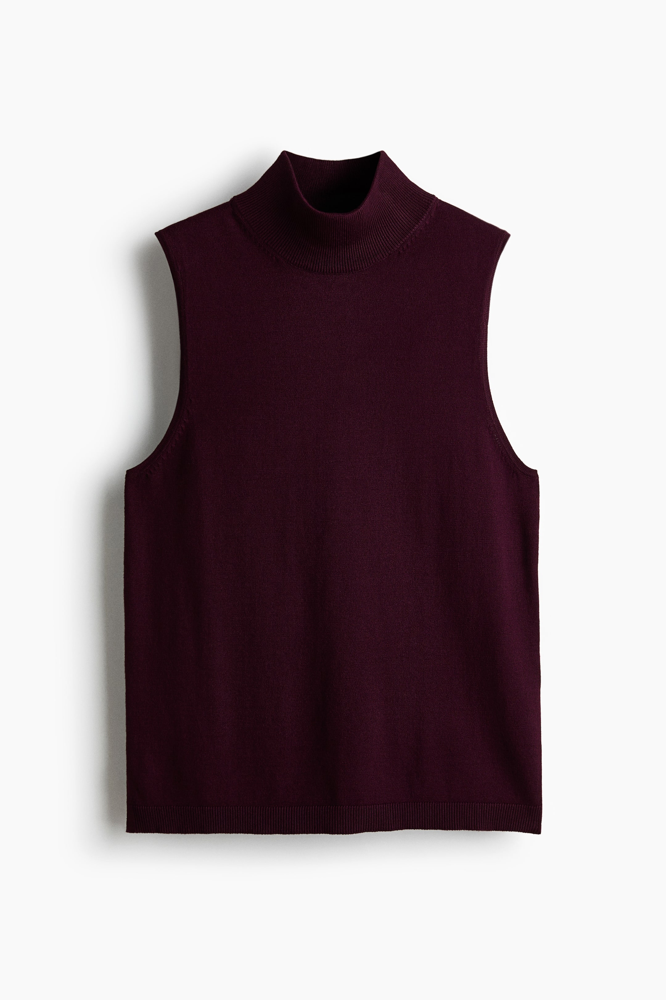 View larger image: A deep burgundy sleeveless mock neck top is showcasing its front, featuring a ribbed mock neck and a ribbed hem.