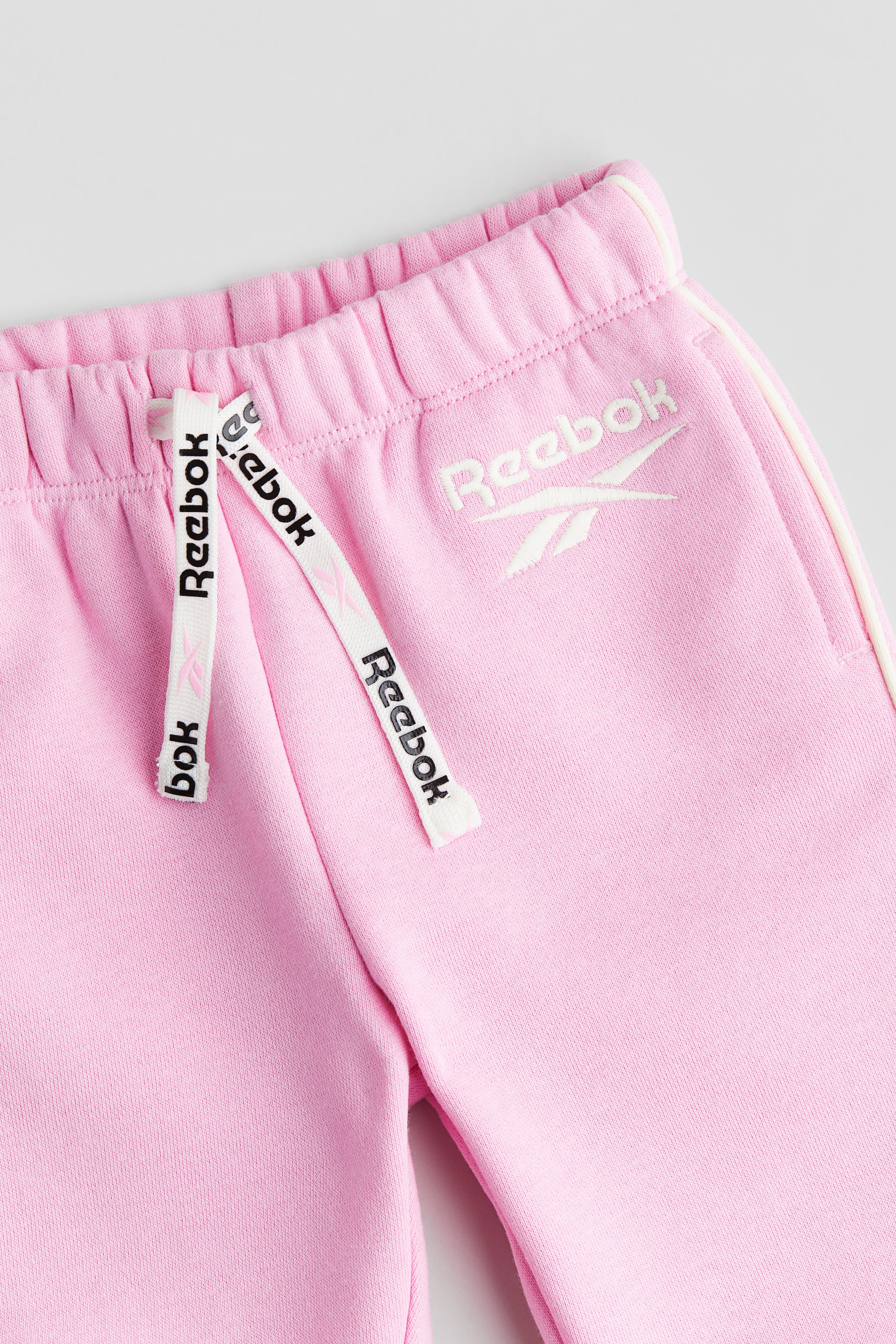 Text-motif joggers - Pink/Reebok - Kids | H&M GB 2