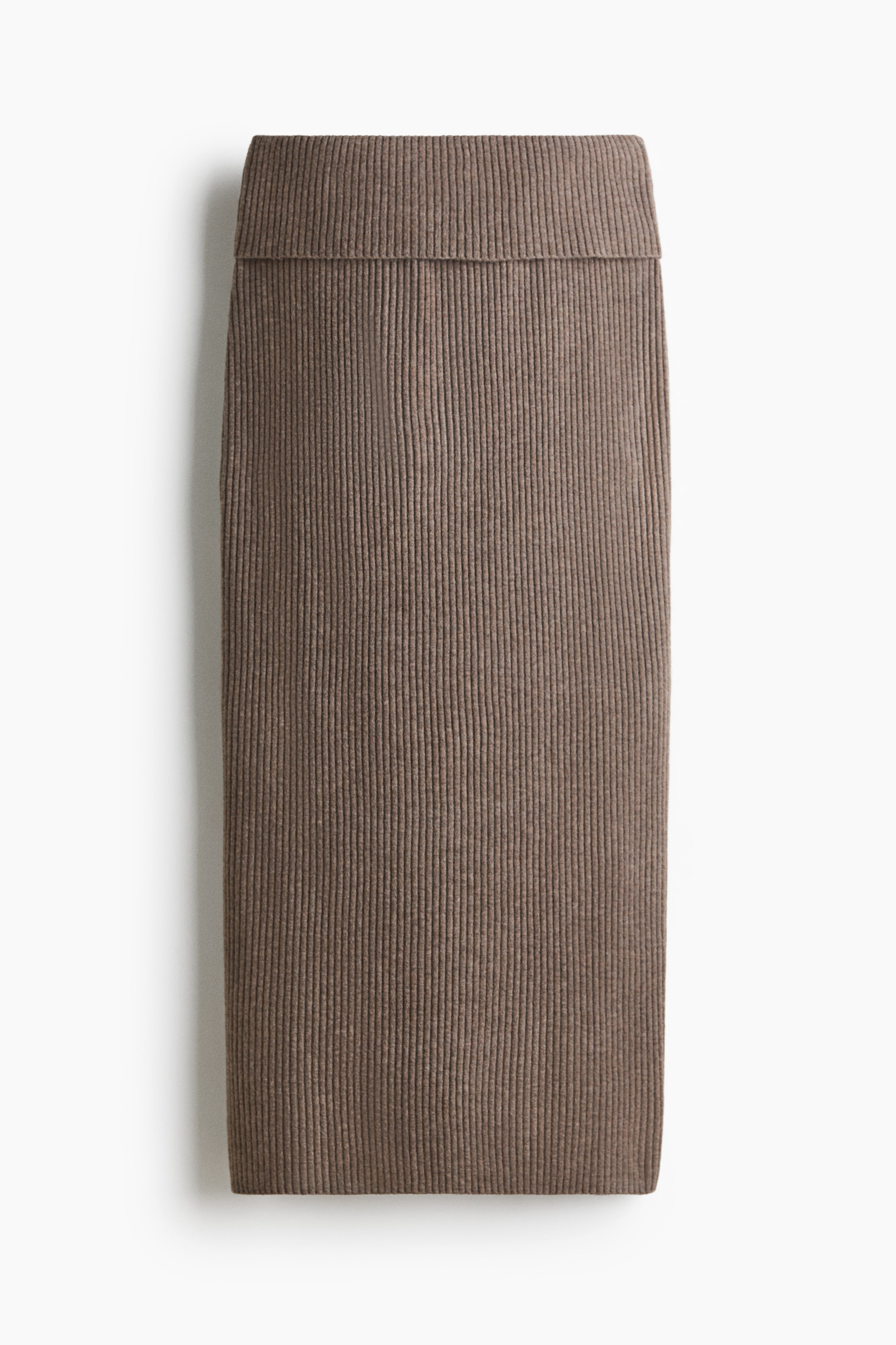 View larger image: A brown ribbed knit skirt is laid flat, showcasing a broad, folded waistband and a straight silhouette.