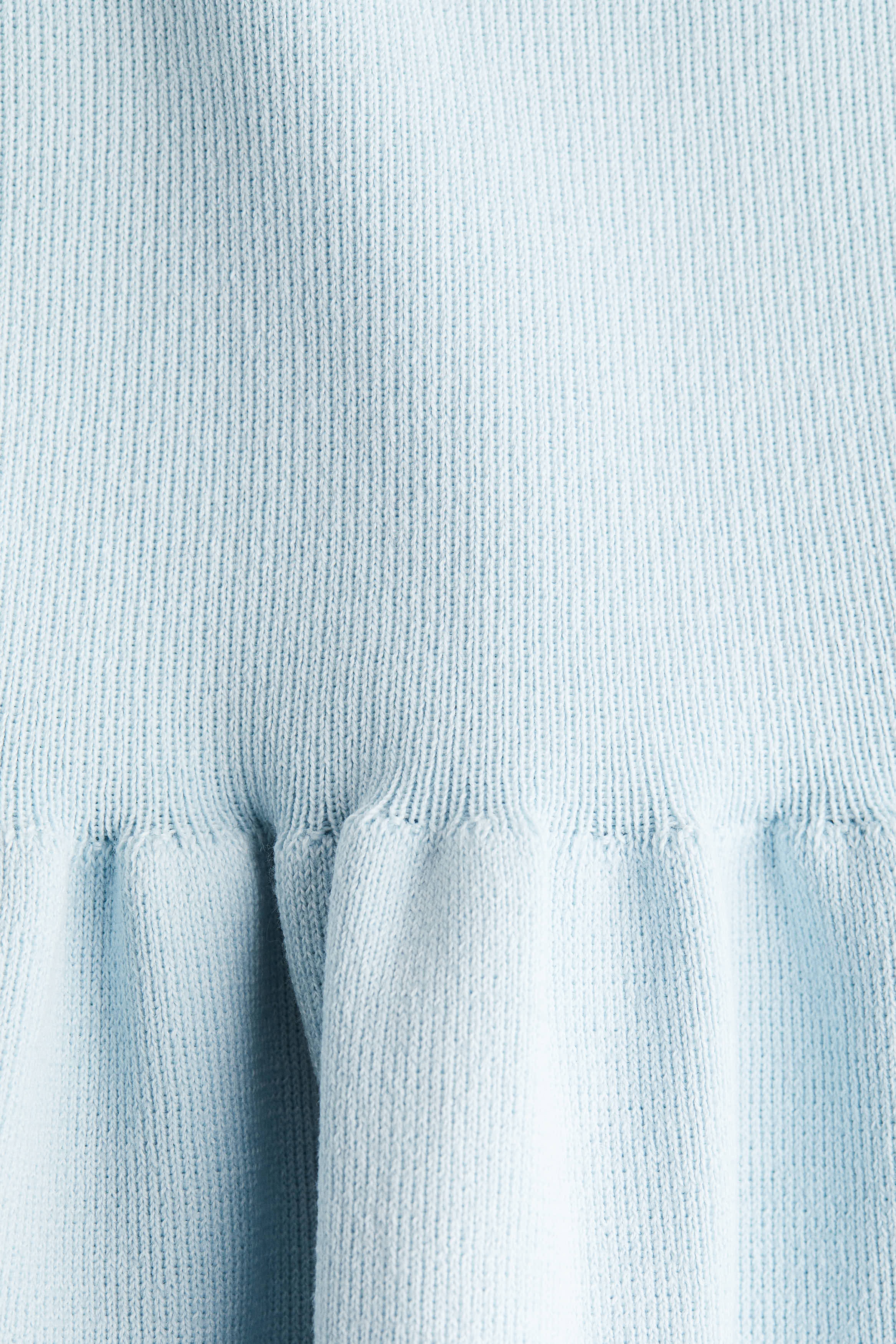 Knitted peplum top