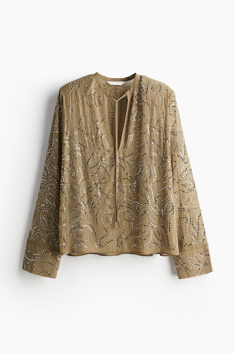 Bluza ukrašena imitacijama dragog kamenja