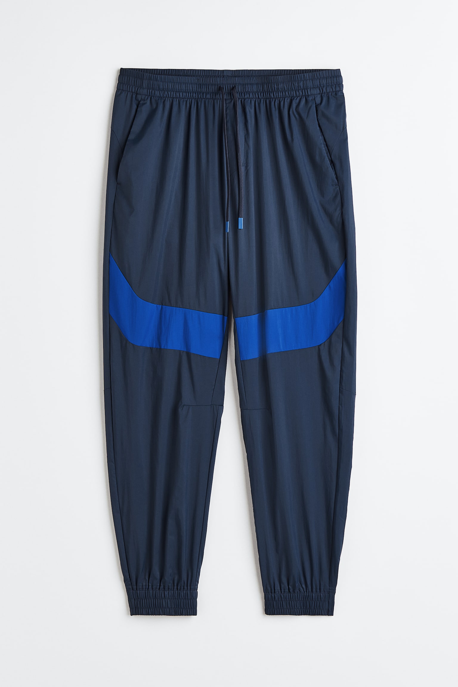 Water-repellent track pants - Dark blue/Bright blue - 1