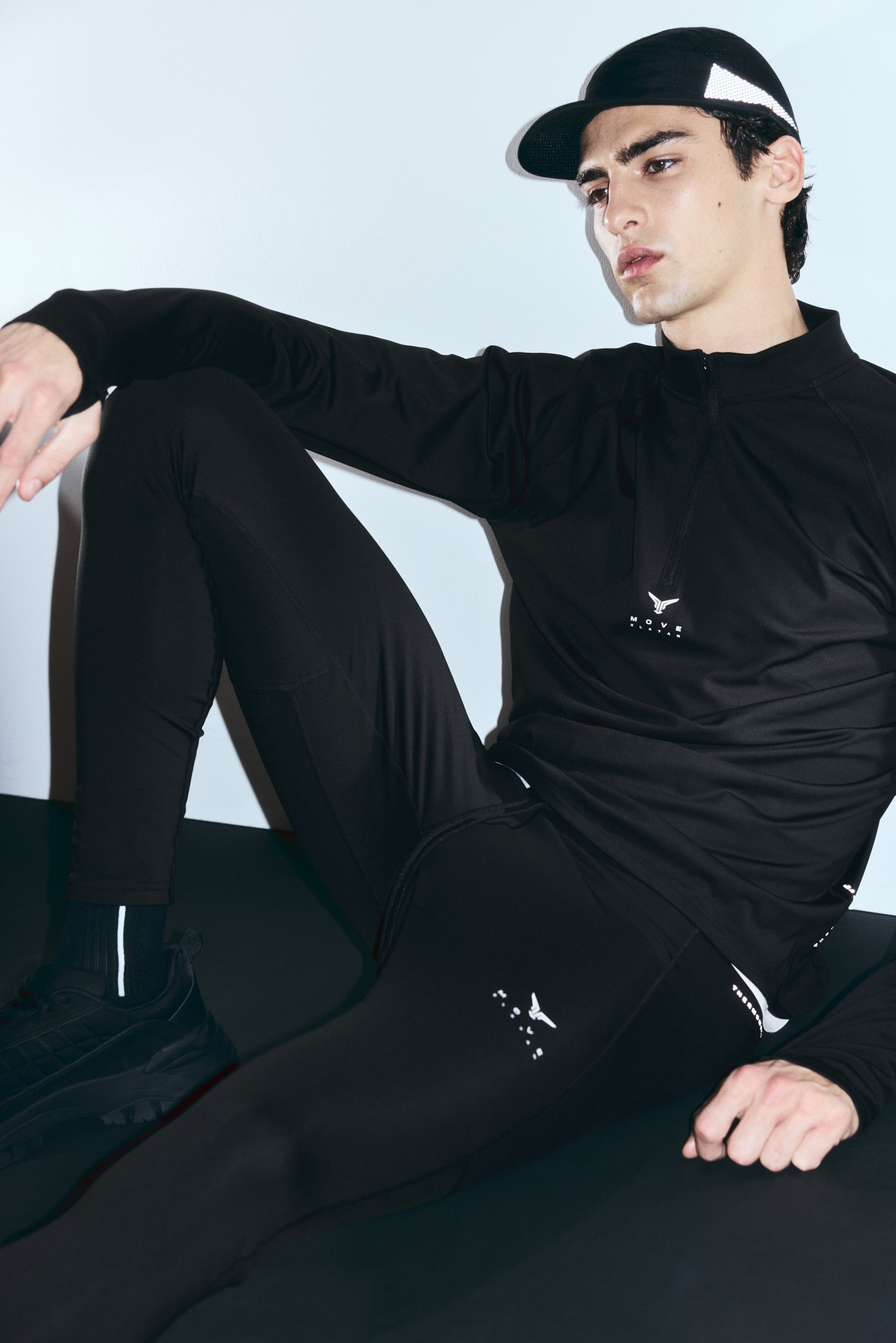 View larger image: Warming zip-top sports top with ThermoMove™ - Black/Move Zlatan - Men | H&M IN 3
