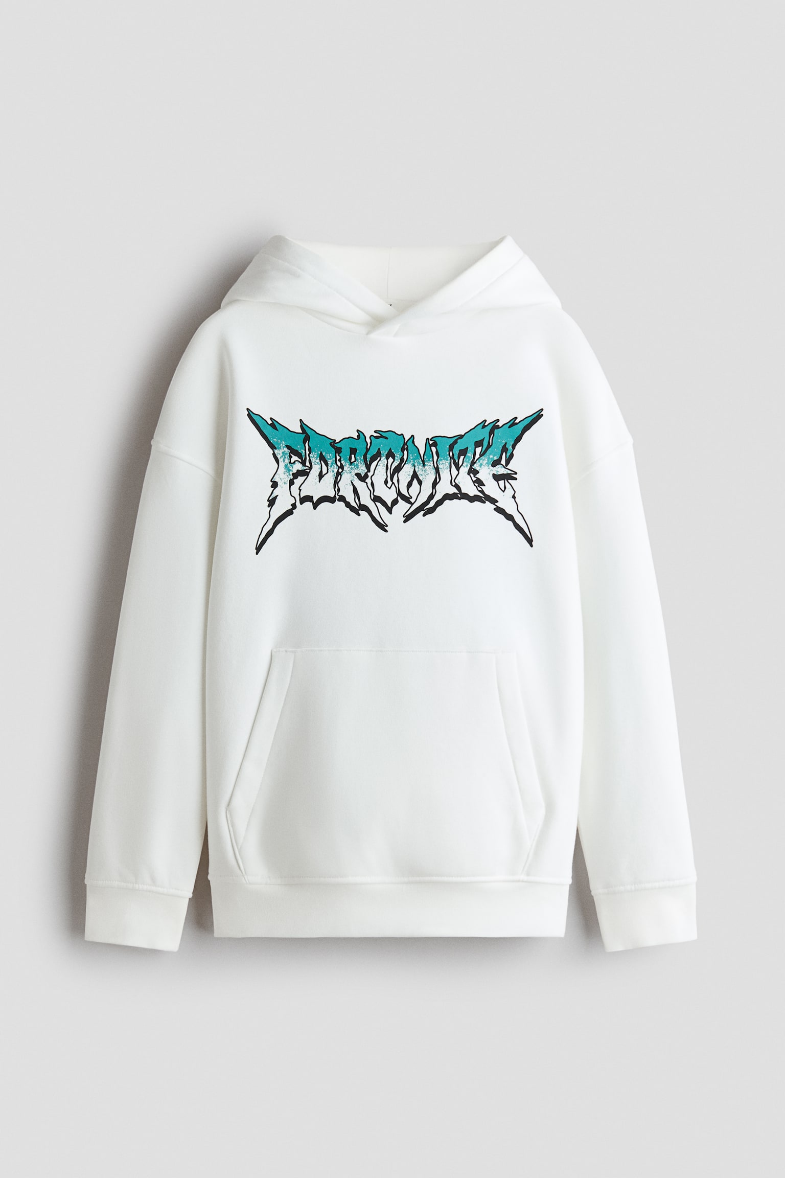 A front-facing view of a loose-fit white hoodie featuring a wrap-front lined hood, dropped shoulders, and a kangaroo pocket. The chest is displaying a stylized, jagged "FORTNITE" graphic printed in a teal and white gradient with a black outline.